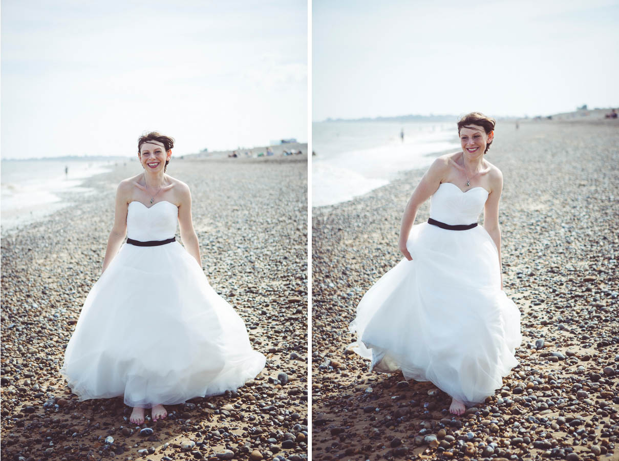 Bride photographs on the beach