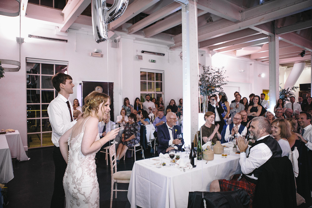 Guests toast bride and groom