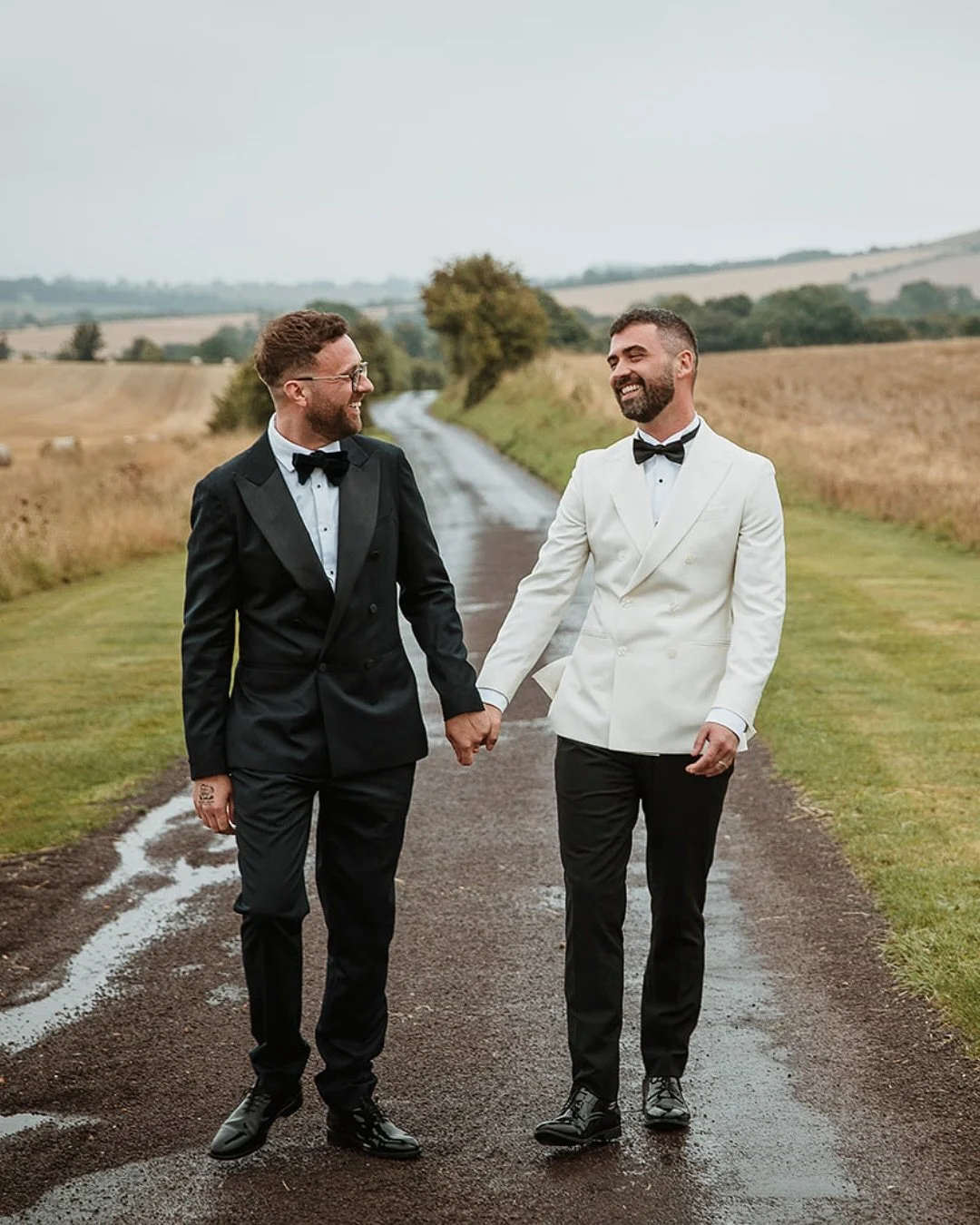 Christopher &amp; Harrison&rsquo;s wedding at Wellington Barn, Calne, unfolded against the gentle patter of rain and the rolling Wiltshire hills. Inside, the barn glowed with candlelight and warmth, a perfect counterpoint to the weather outside. Ever