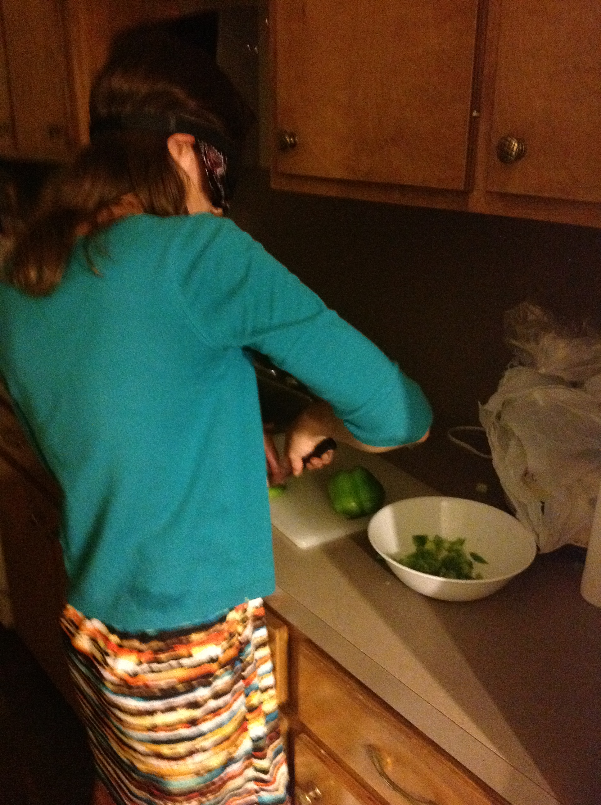 Nicole chops a bell pepper in Home Economics class.
