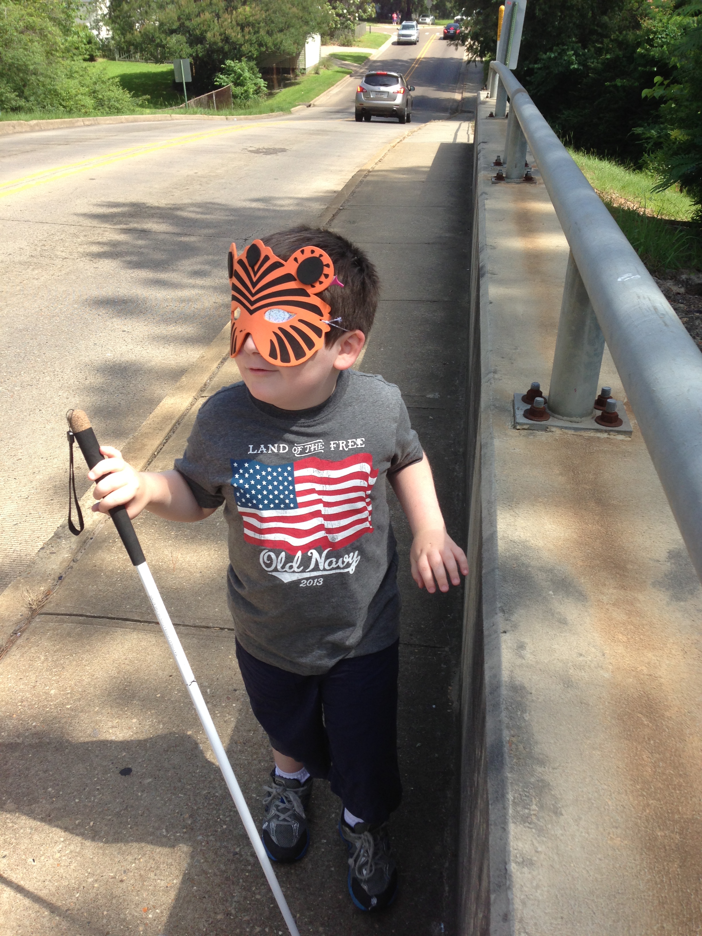 Strider uses his cane while traveling on the Farmerville bridge