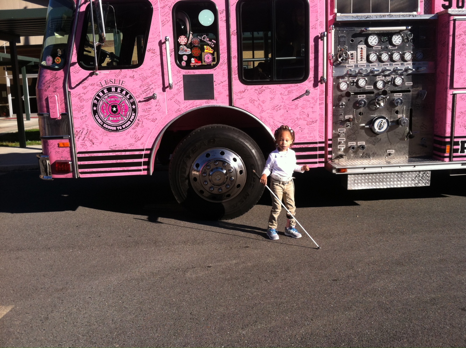 Passion in front of the Pink Heals fire truck;