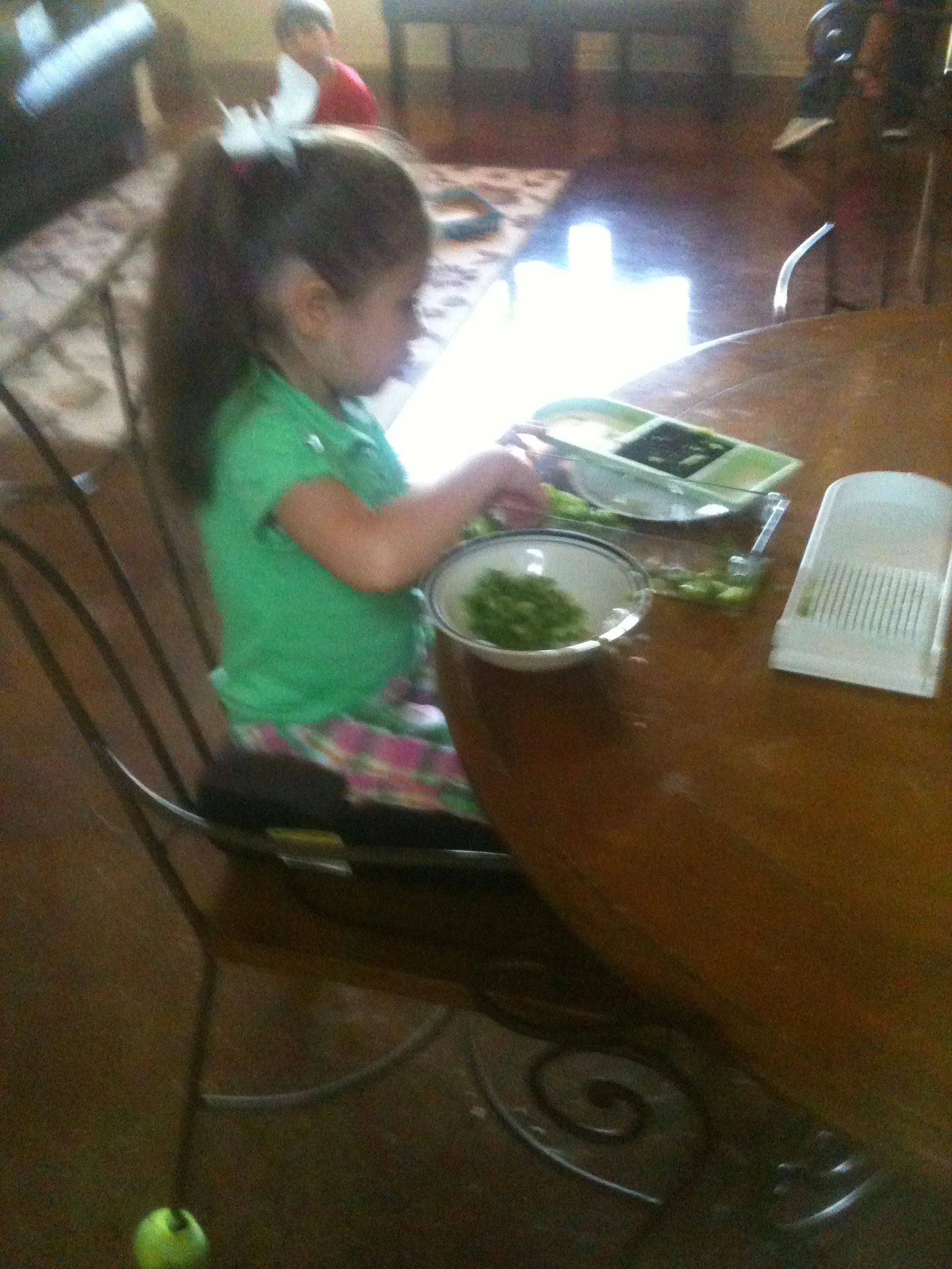 Baylee chops a bell pepper