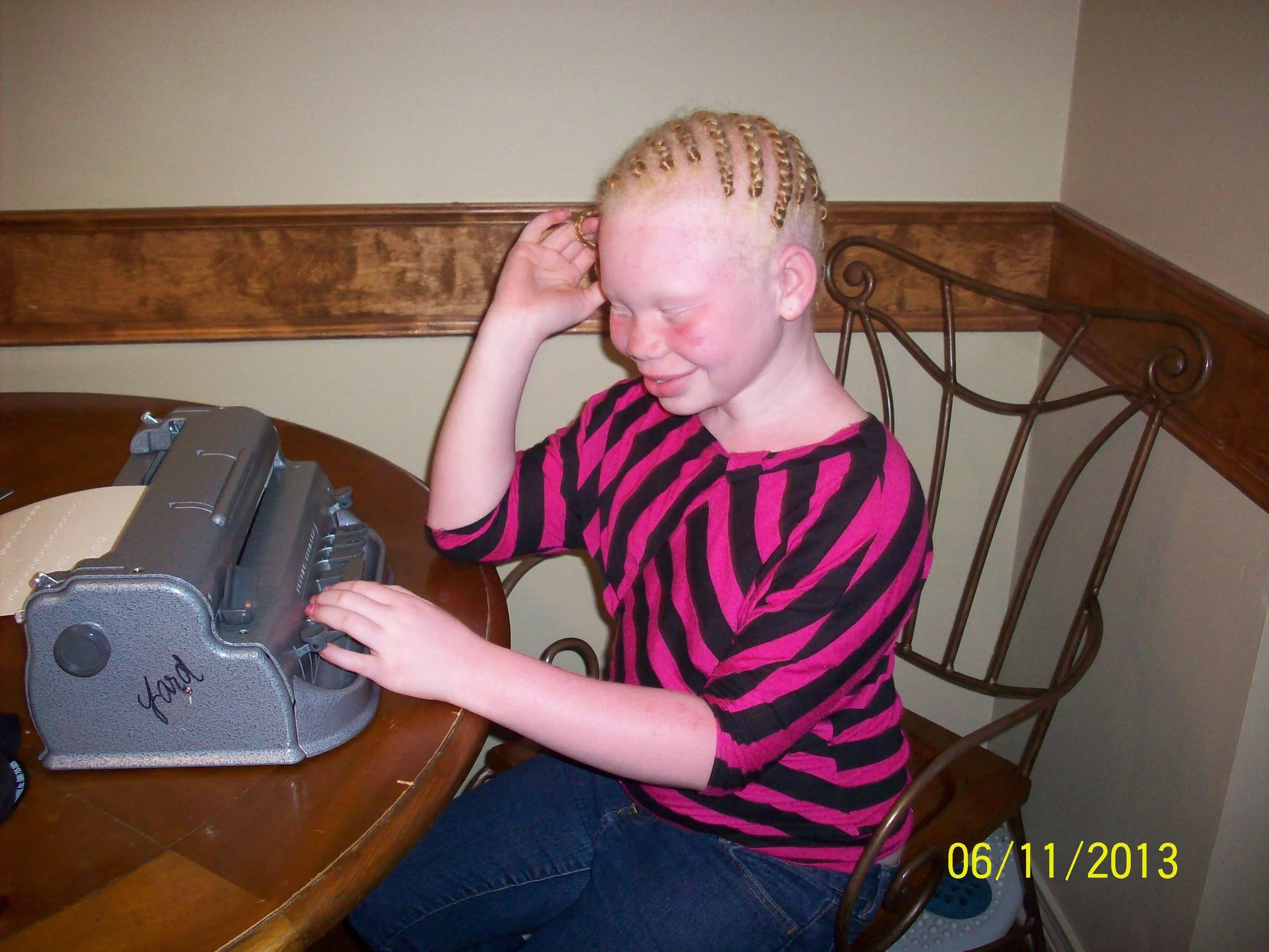 Rekendra writes braille