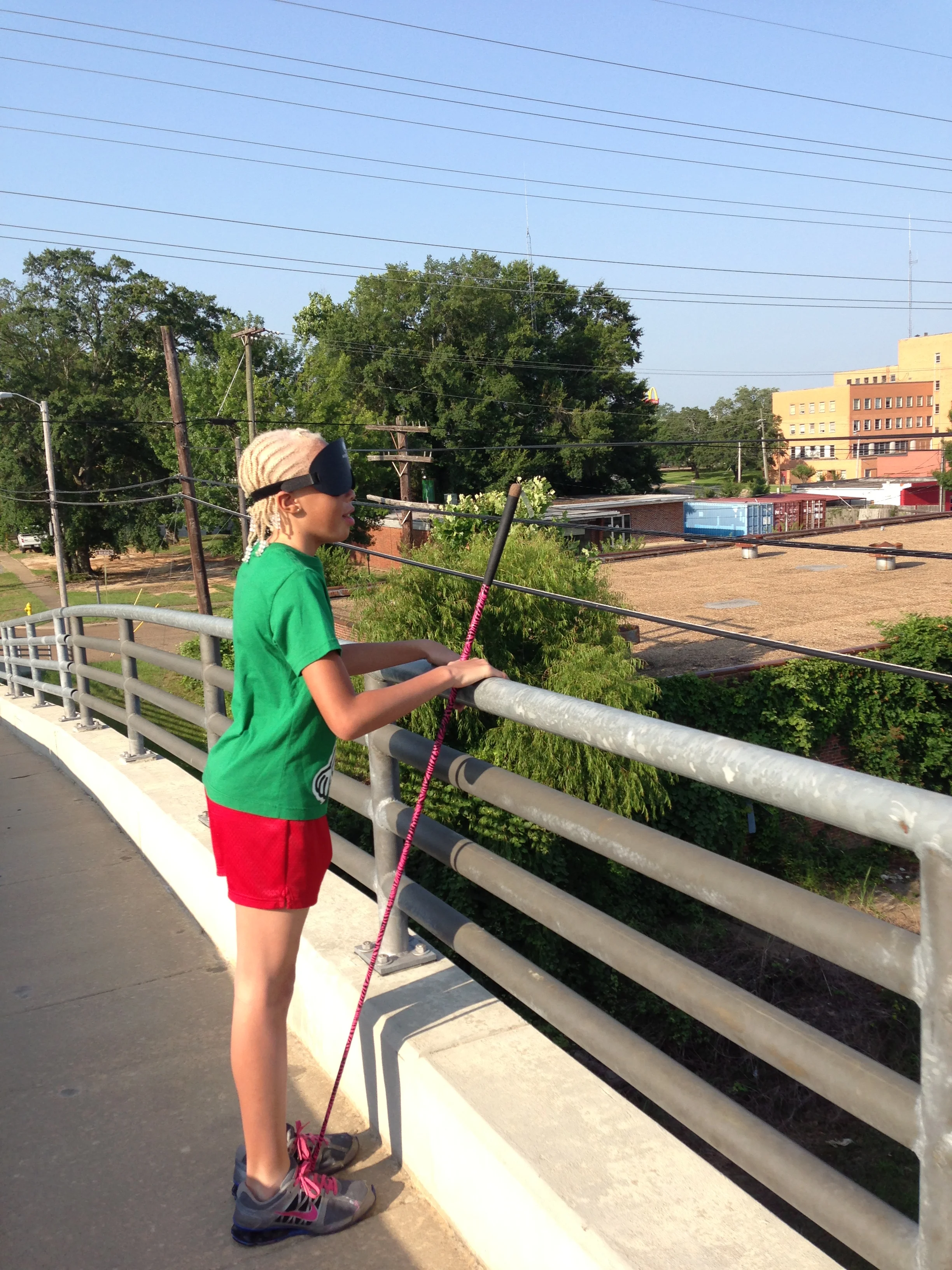 Kiona listens for a train on the Bonner bridge