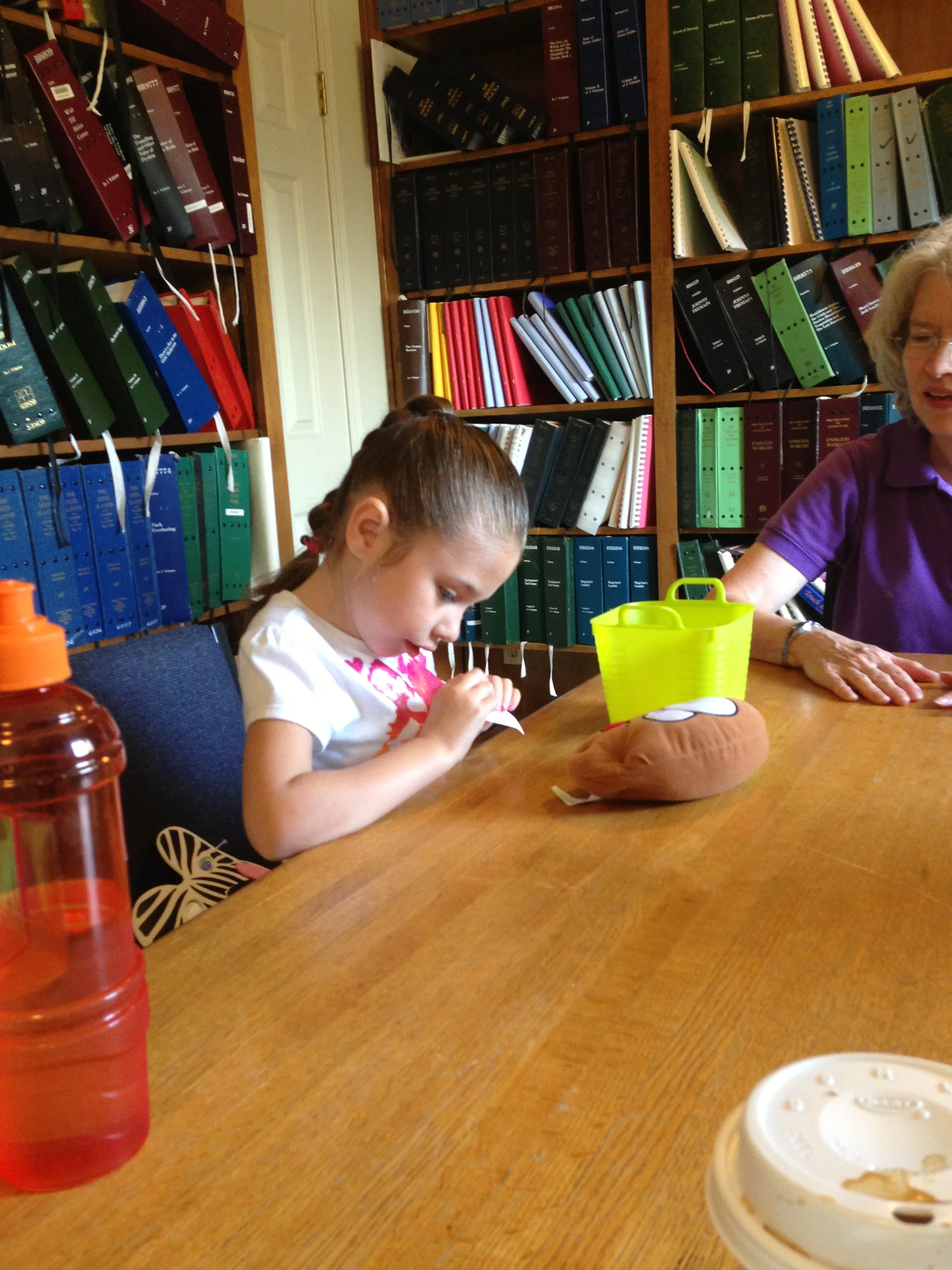Baylee plays hot potato in braille class
