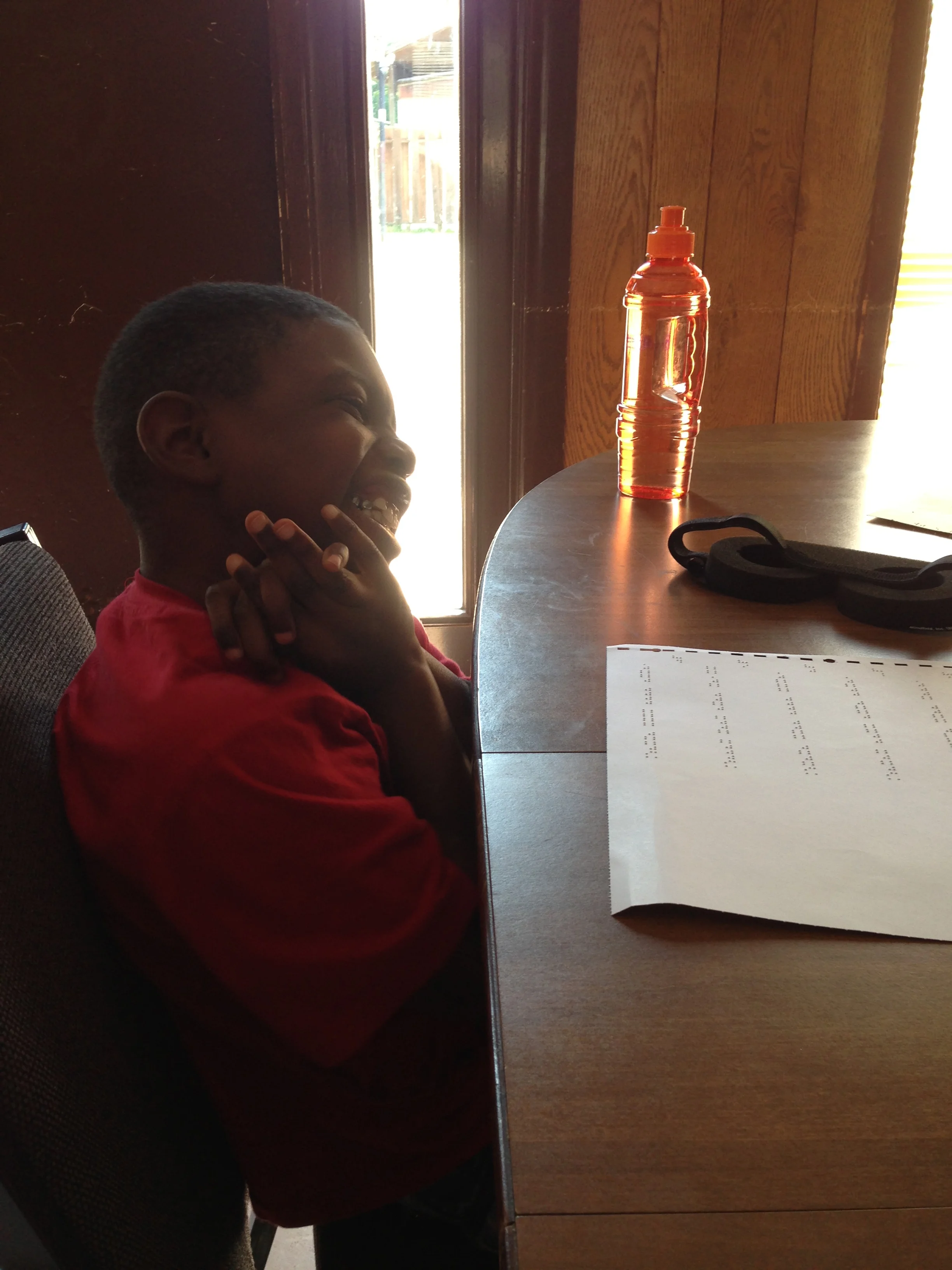 Braylon in braille music class