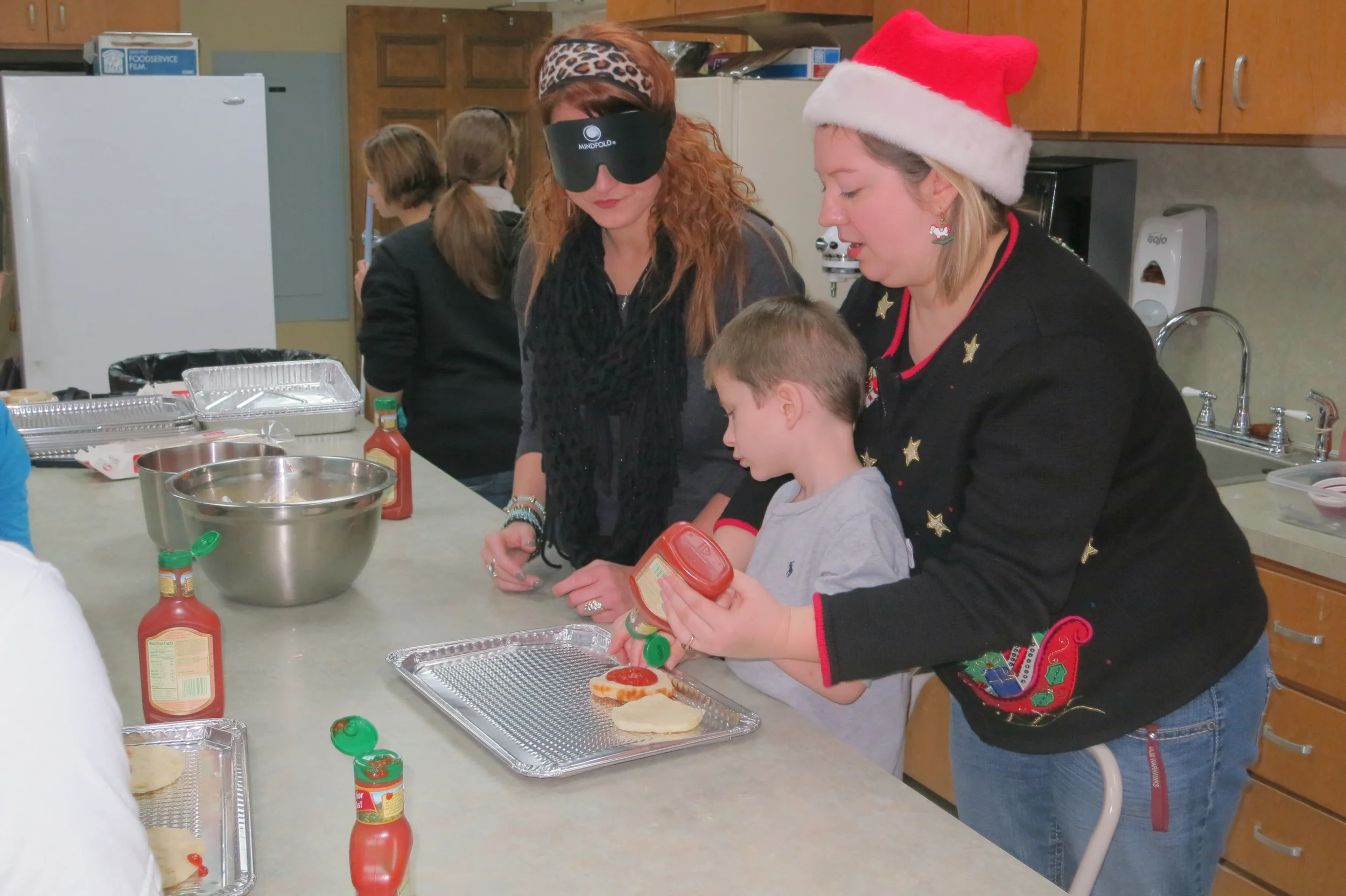 Jordan and family making pizza