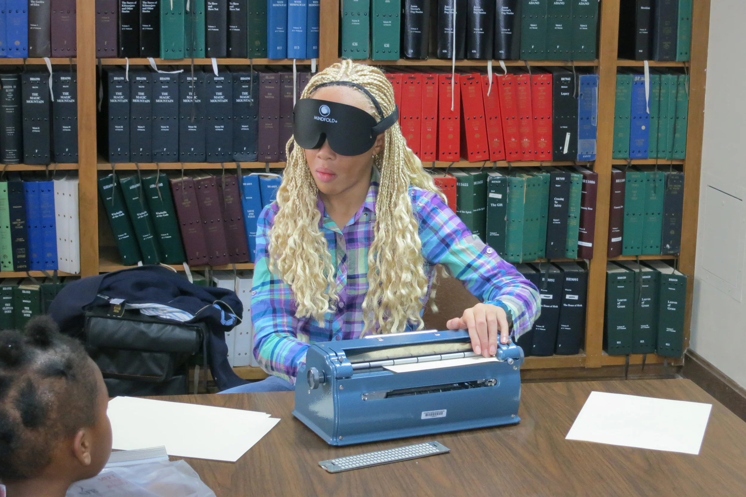 Kiona brailling a letter to Santa