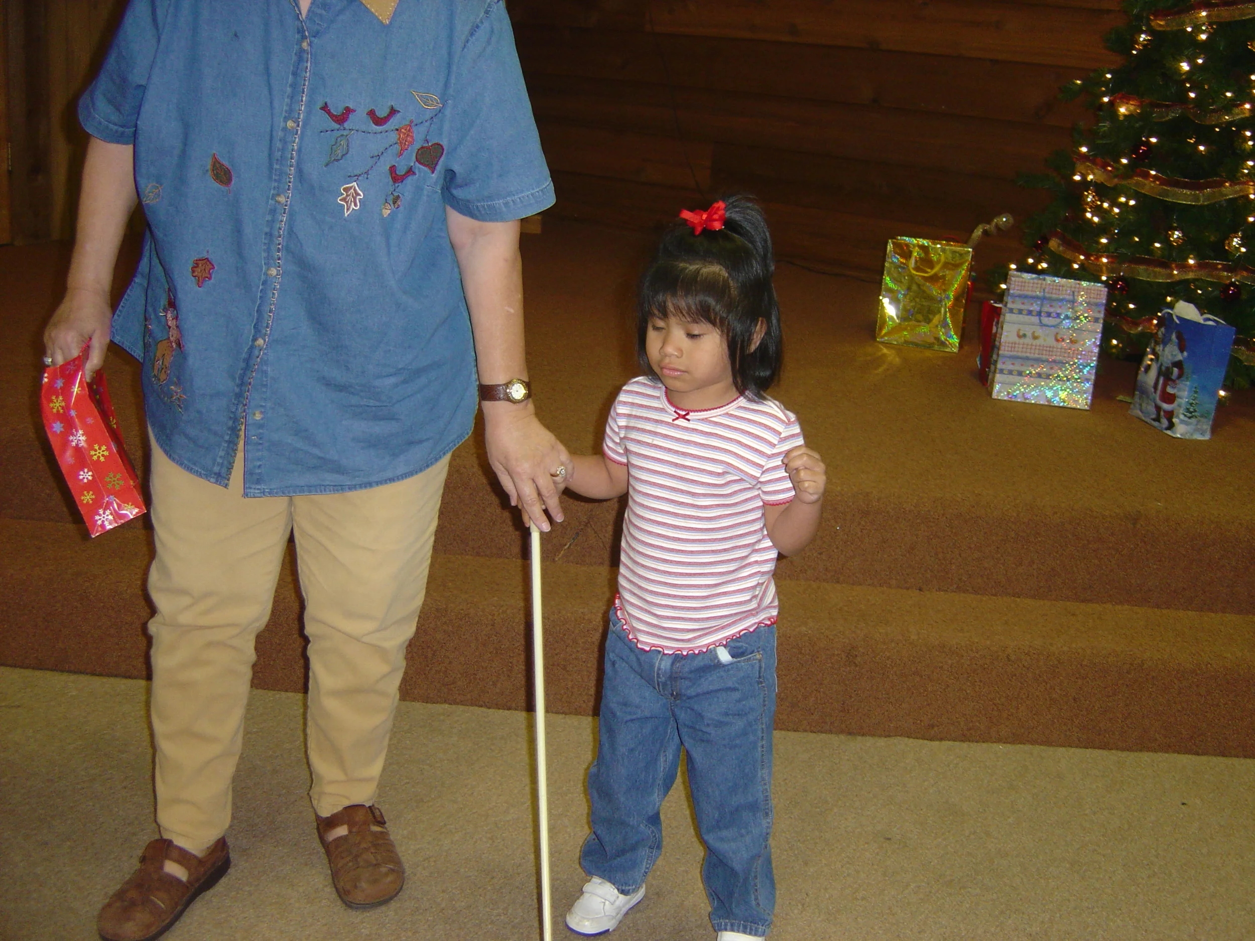 Yemi with Mama at a Christmas event