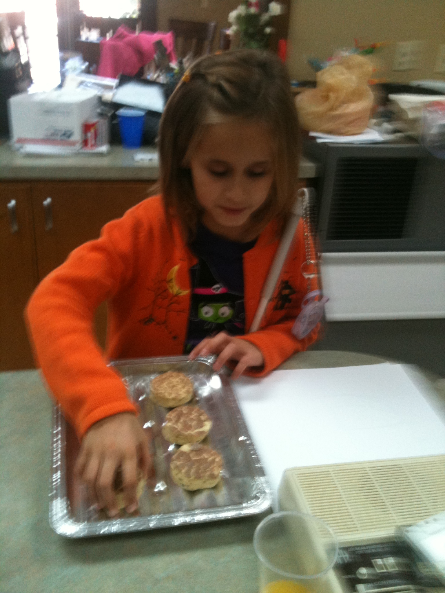 Lindsay lines up her cinnamon buns like a braille cell!