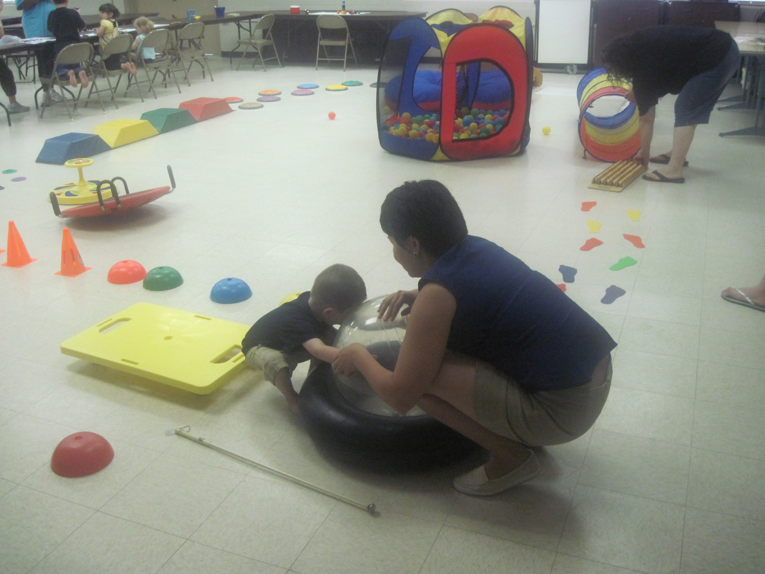 Jordan and Elnora enjoy playing on the tactile obstacle course