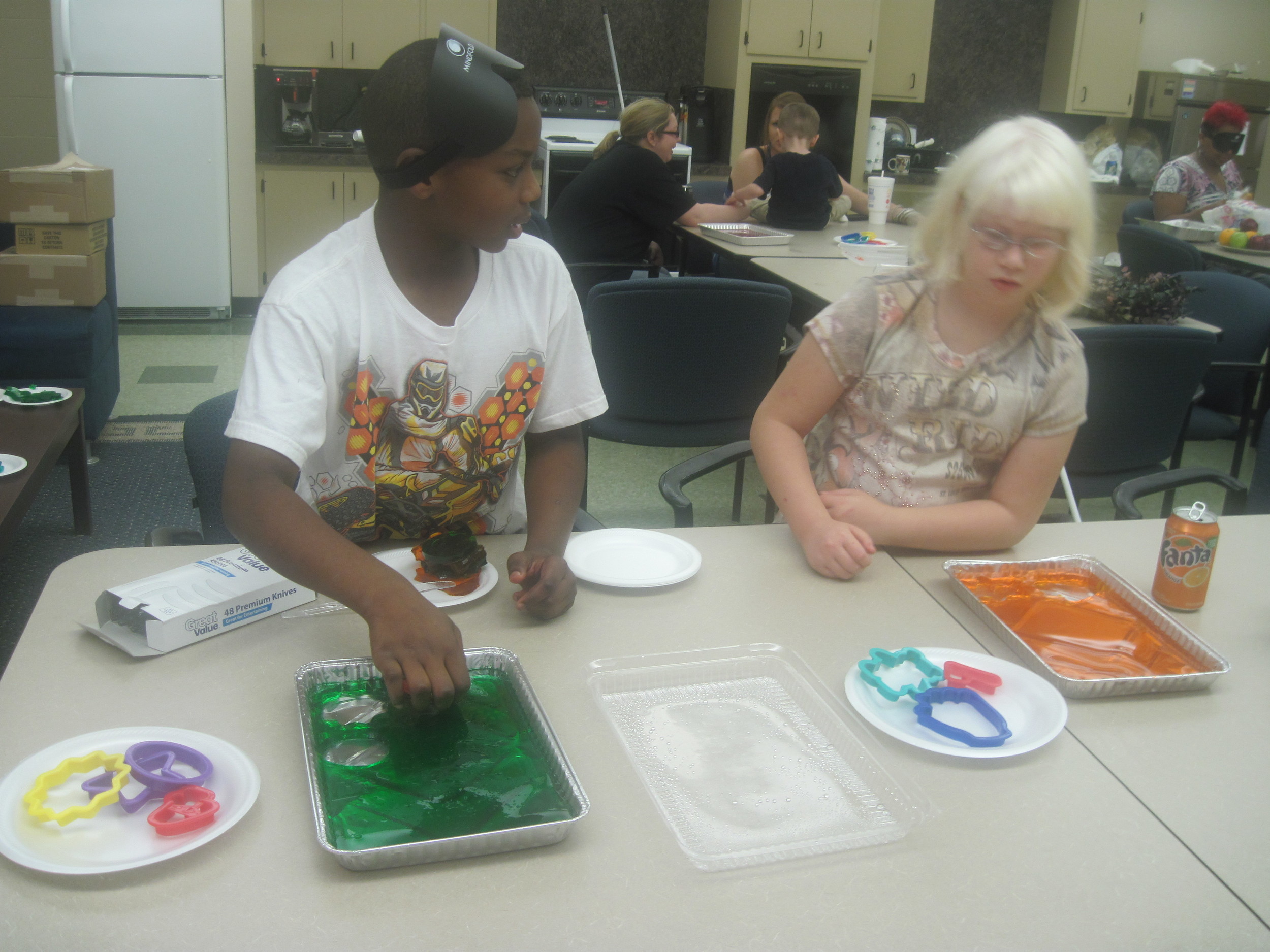 Terrell and M'Kayla cut out some spring-themes Jello jigglers