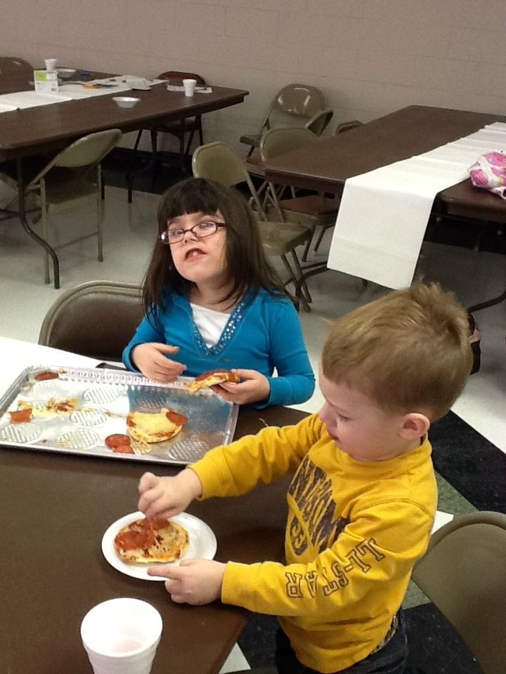 Jadyn enjoys the pizza she made all by herself!!!!