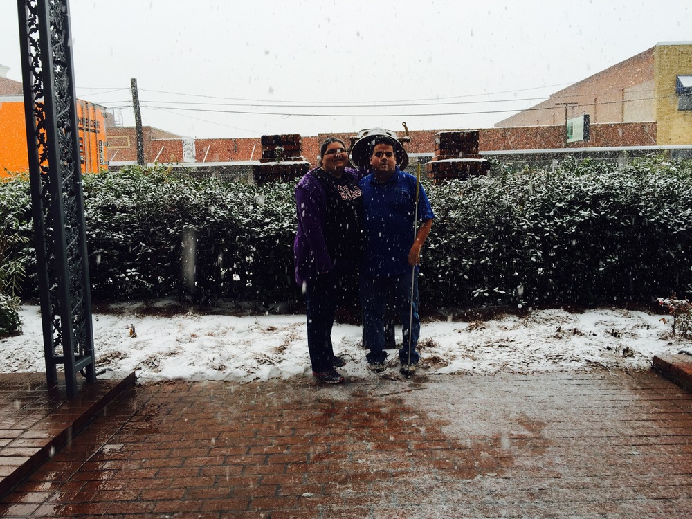 Eric and Krystal in the snow by the freedom bell