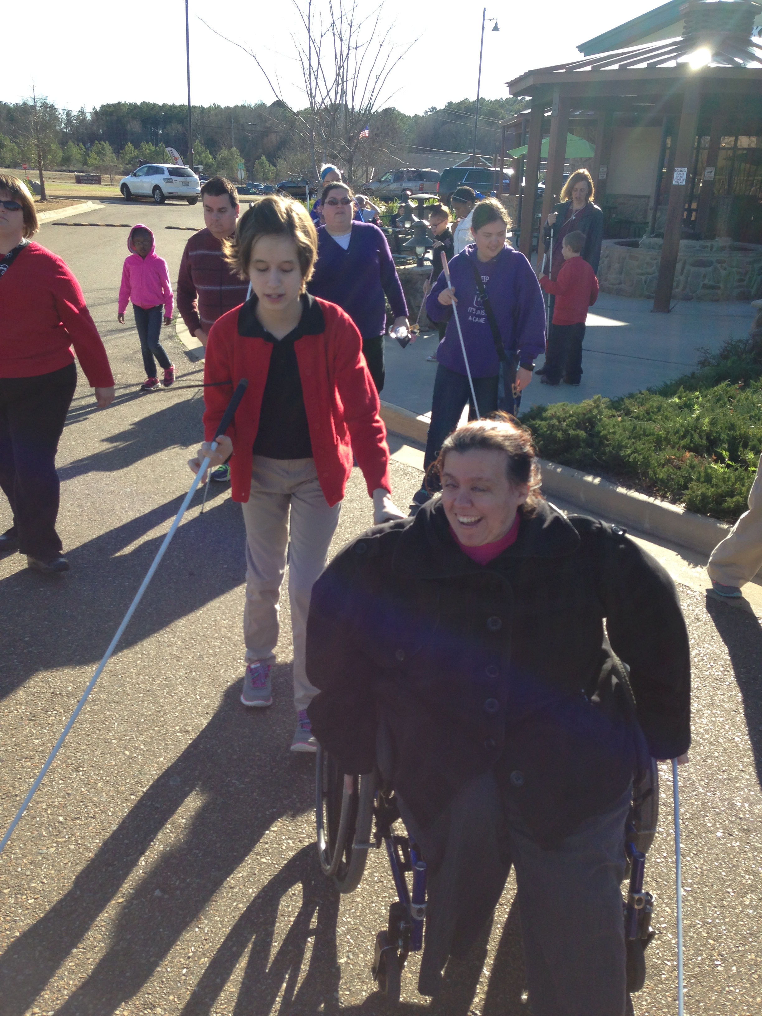 Treva and Lindsay lead the group as we tap our canes from the ice shop to the park!