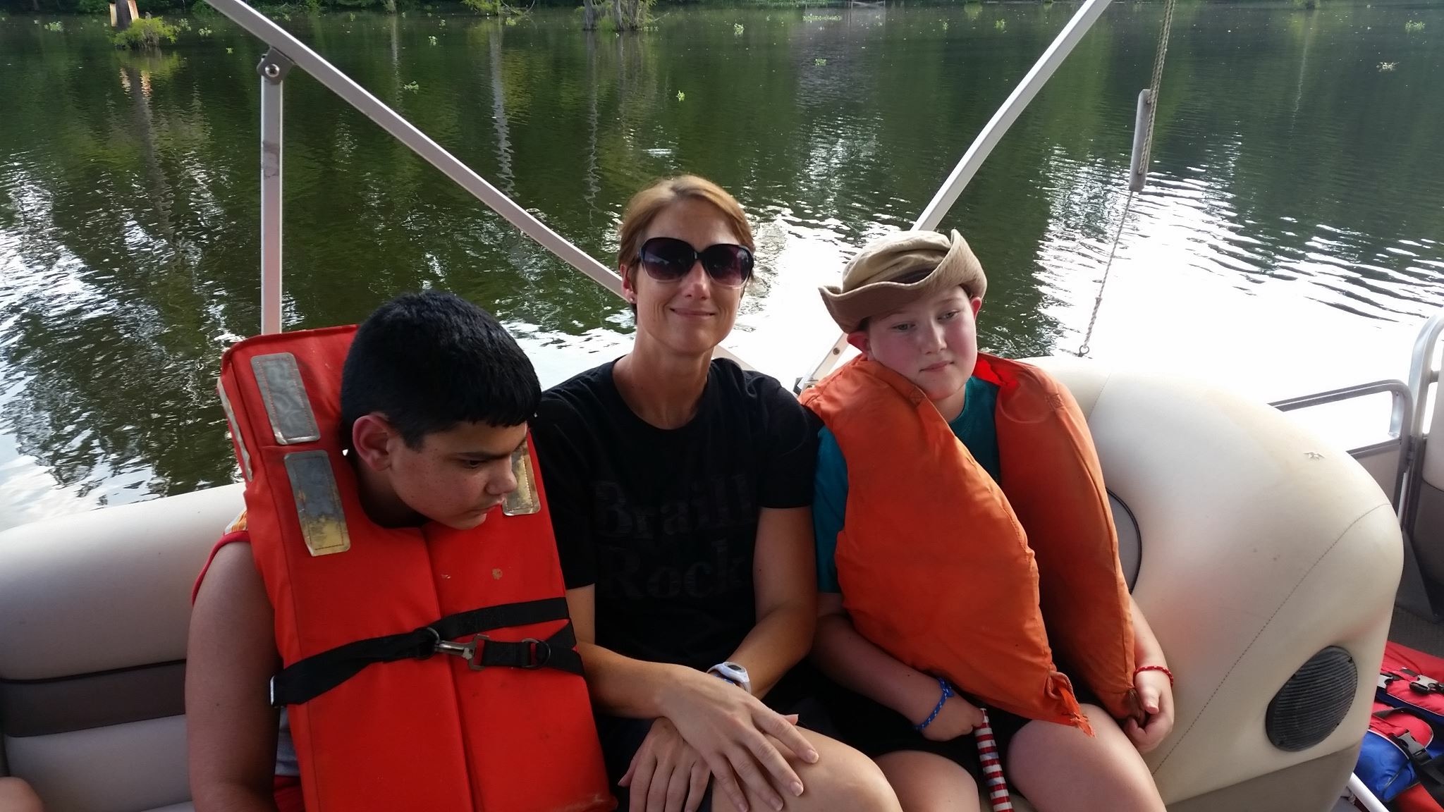 msalison,trae,andnicholasenjoytheboatride.JPG