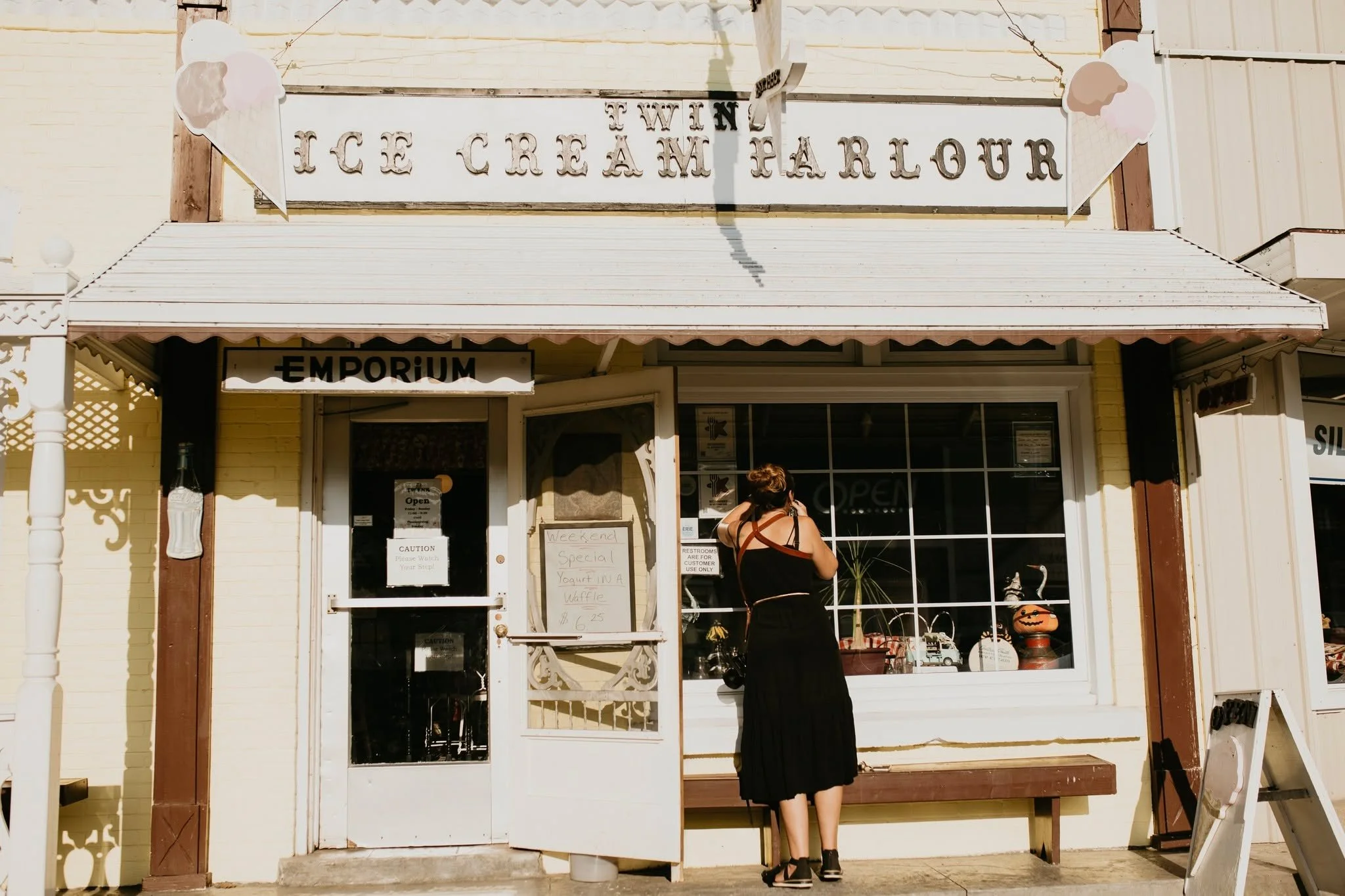 Me shooting through the window of an ice cream parlour and the shot that I captured. Stopping for ice cream on your wedding day = so fun!