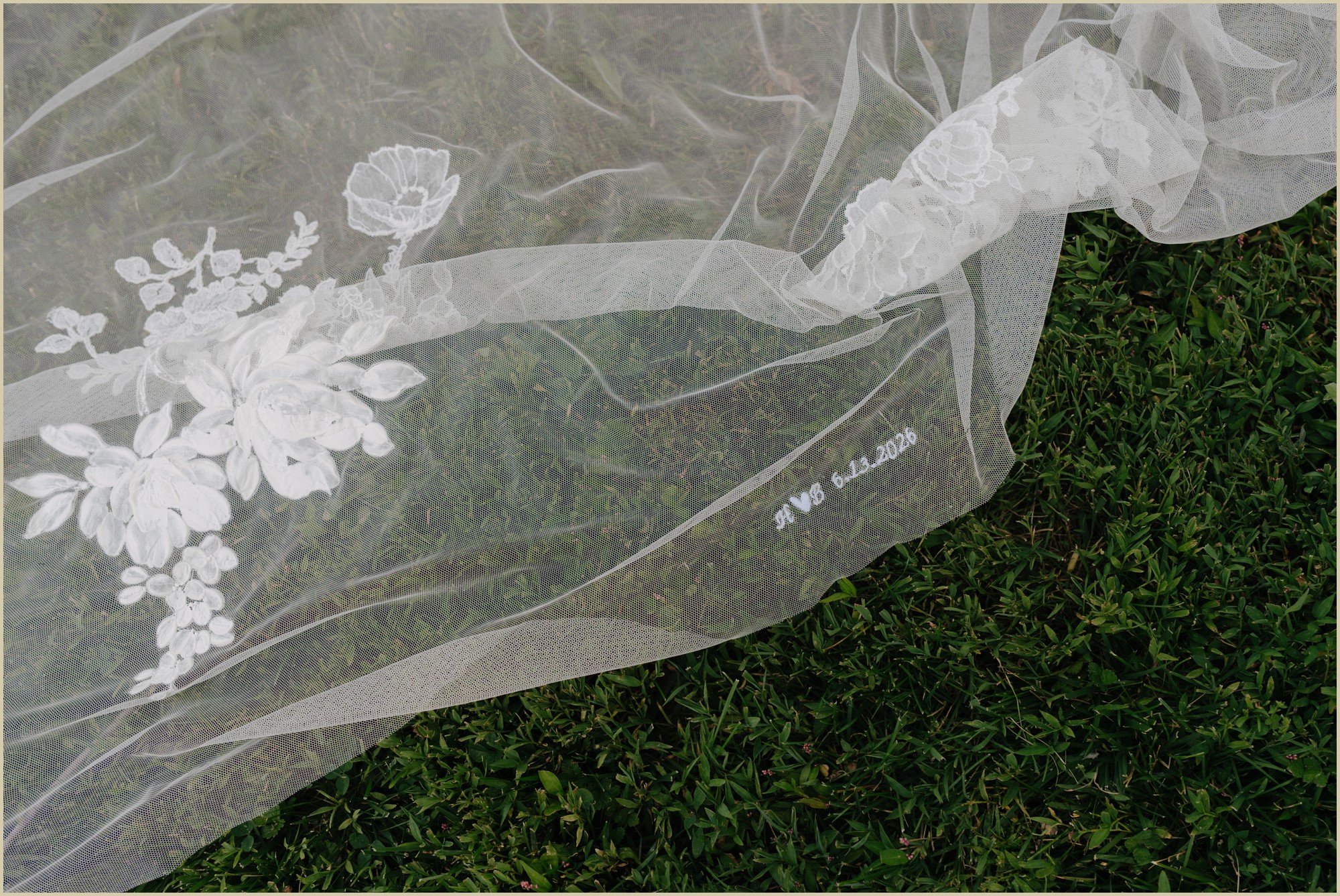 detail of a custom veil with initials and wedding date