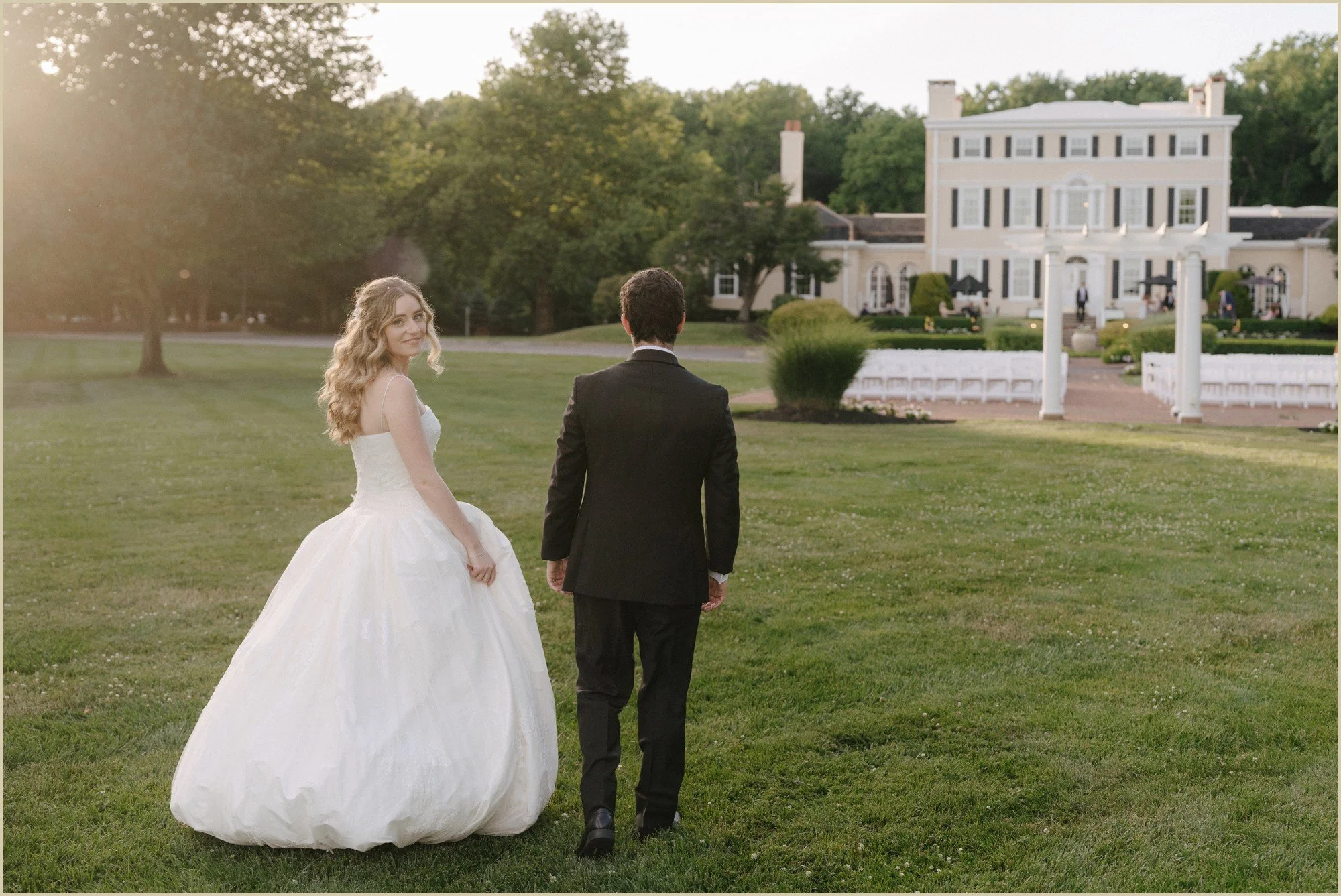 golden hour wedding portraits bride looking back over shoulder