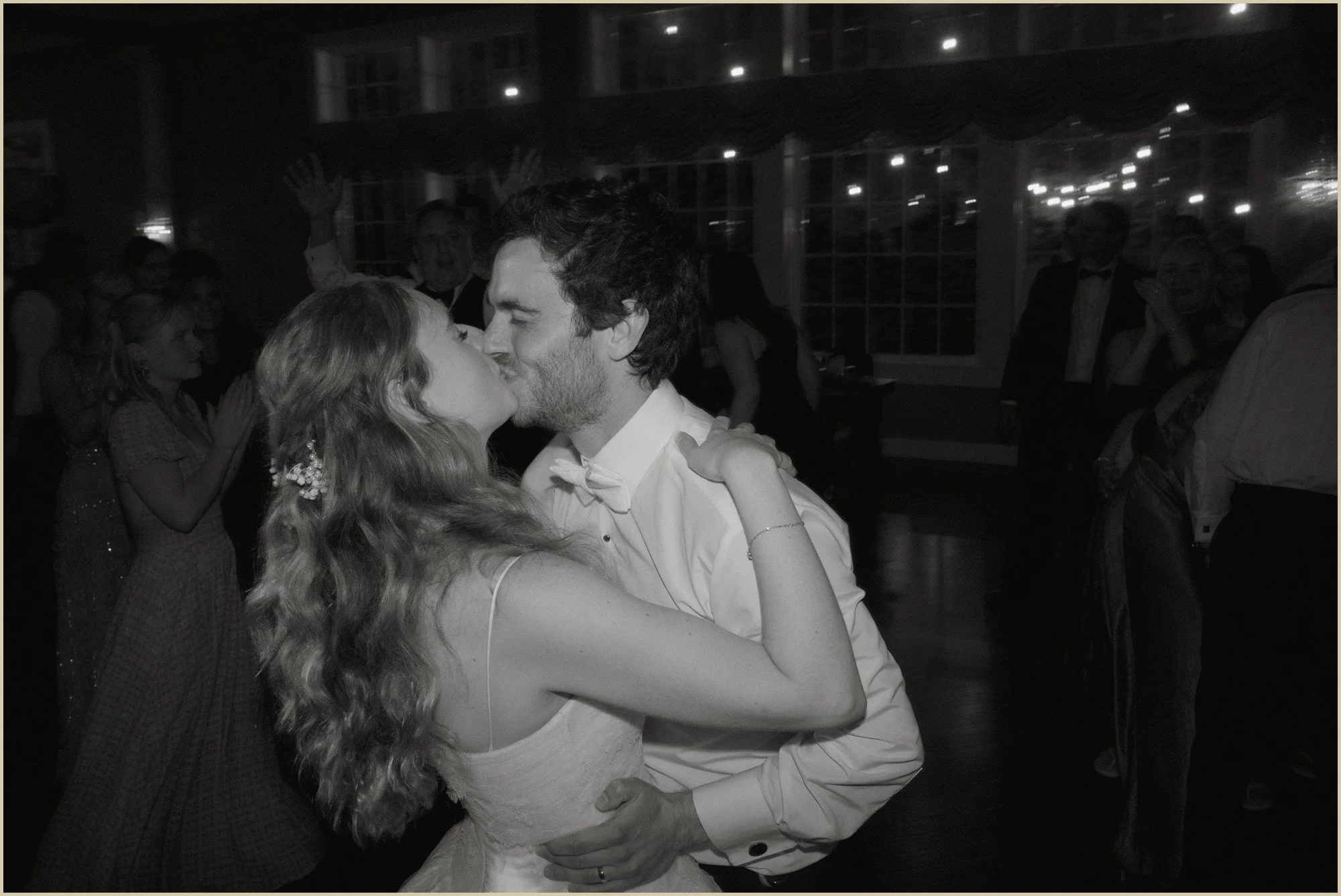 hannah and ben kissing on the dance floor at the end of the night