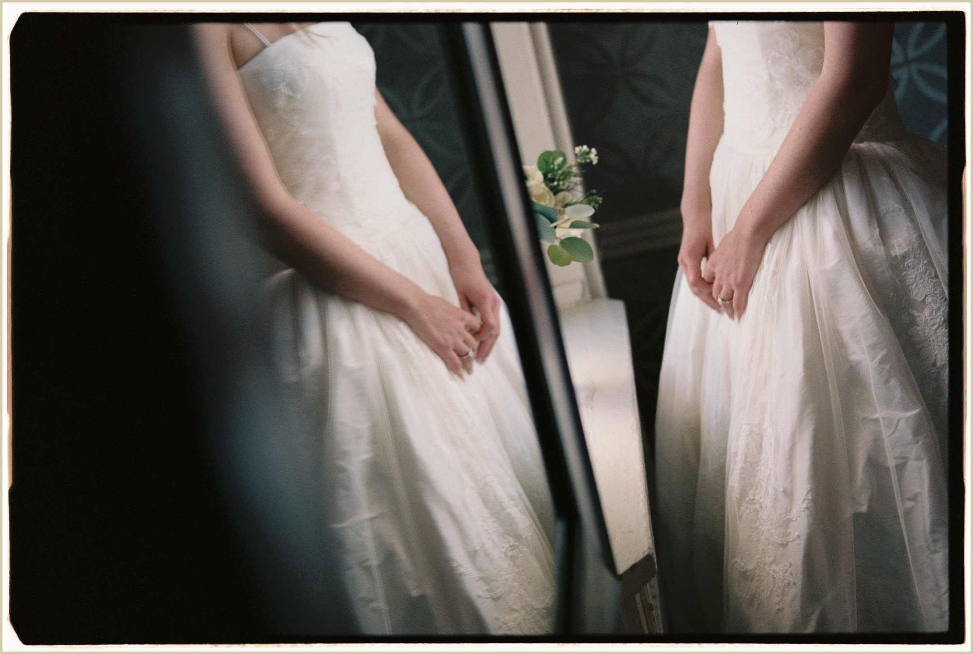 film photography of bride looking in mirror