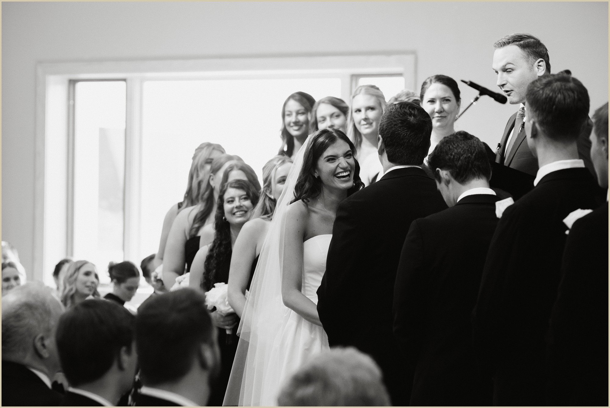 bride smiling at the groom during wedding ceremony
