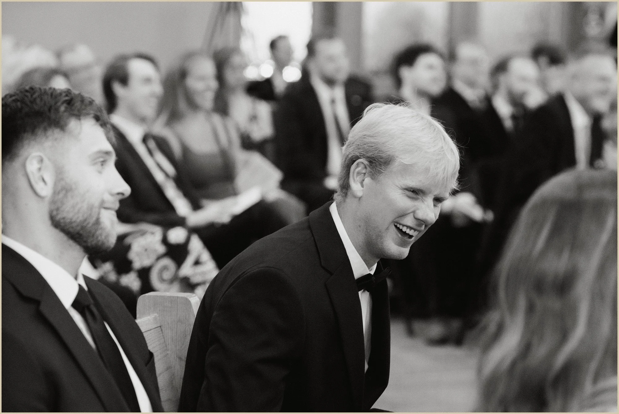 candid documentary style candid of wedding guest laughing