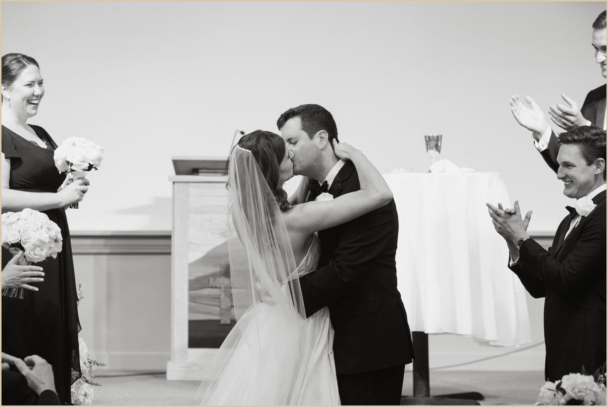 bride and groom first kiss