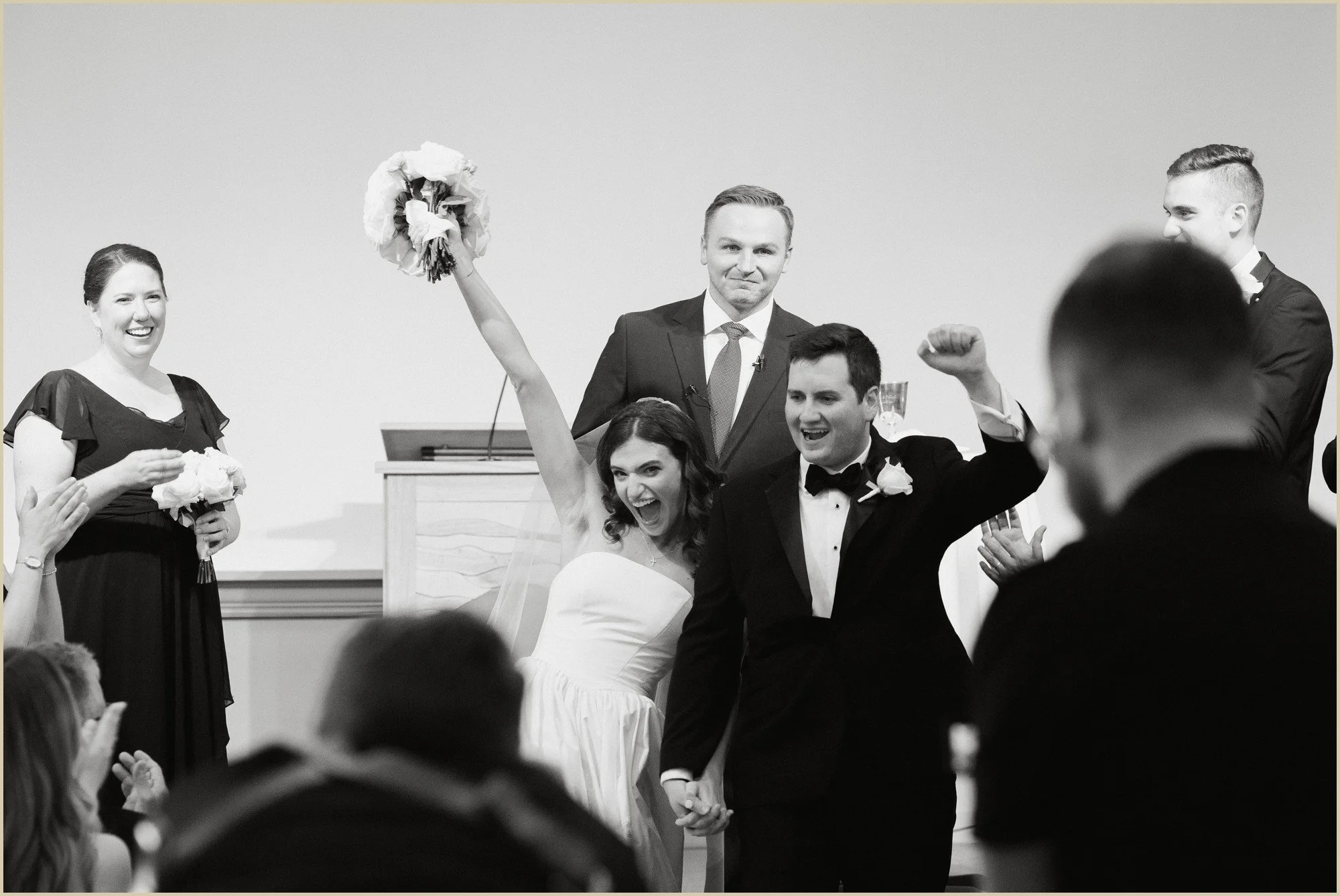 bride and groom laughing and celebrating after wedding ceremony