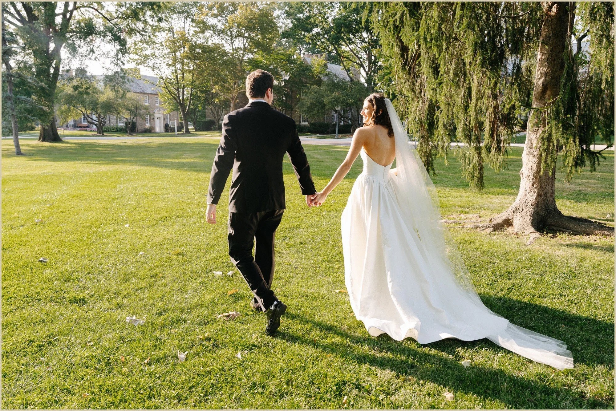bride and groom walking away during golden hour