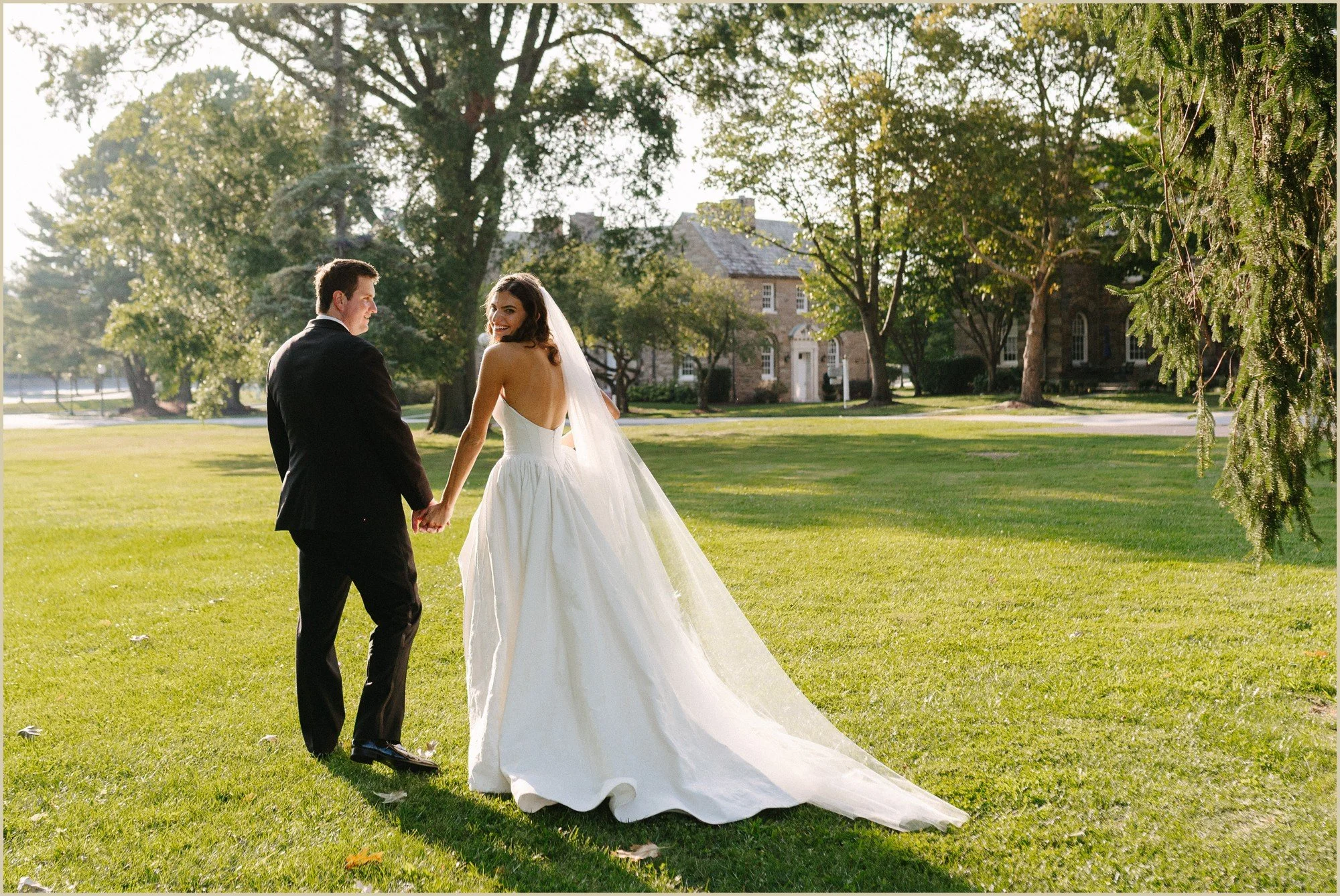 bride looking over shoulder during golden hour portraits 