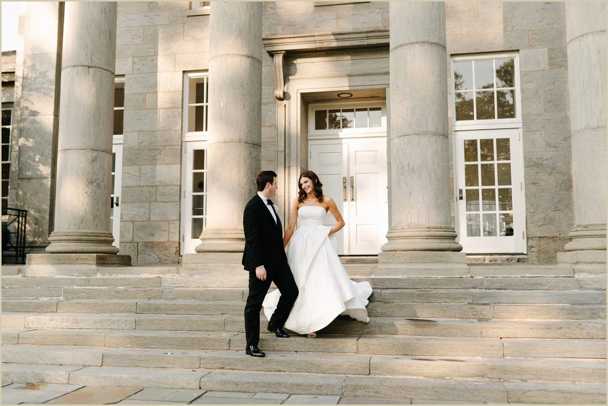 bride and groom on the steps at the ballroom at ellis preserve