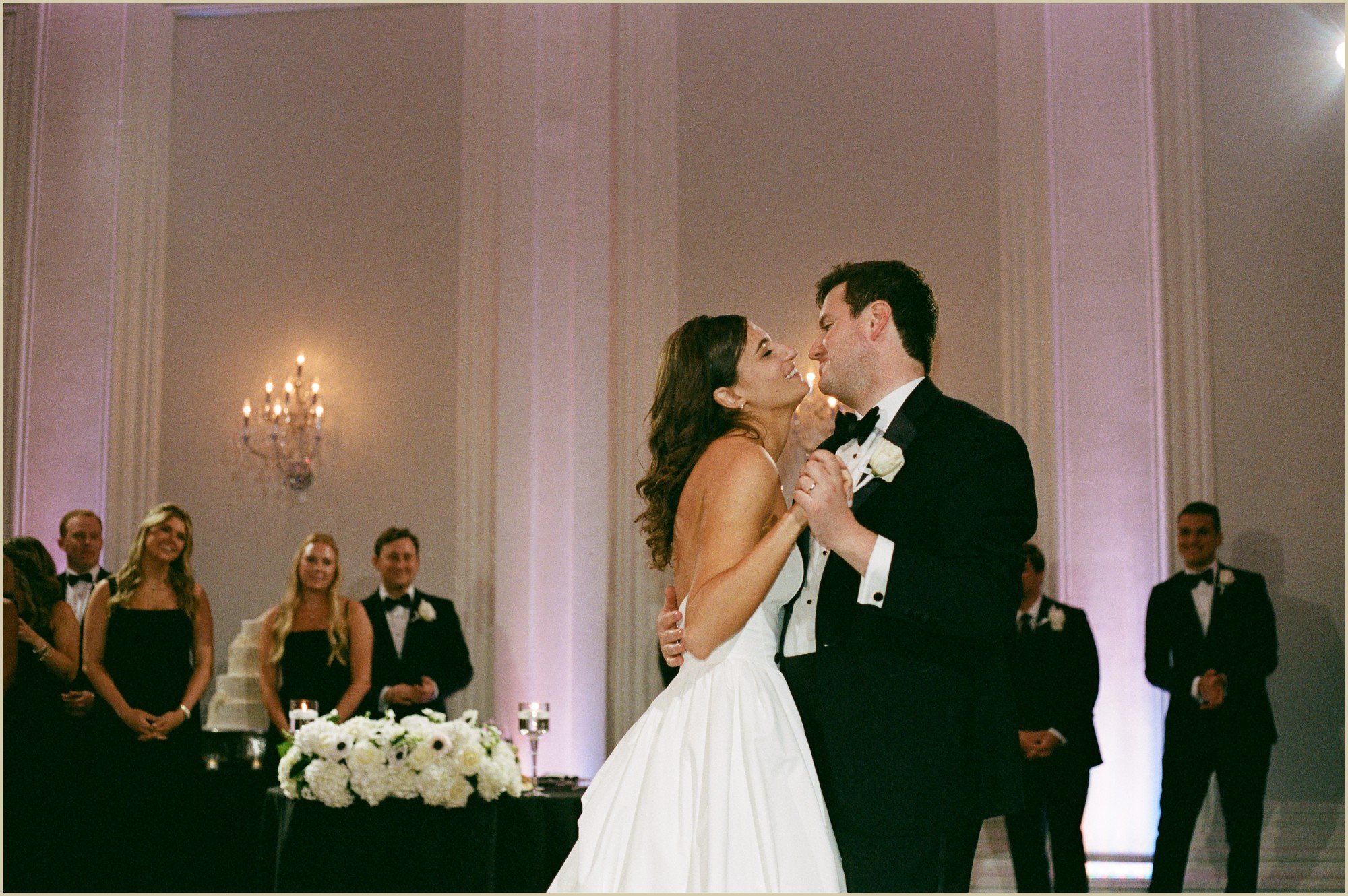 bride and groom looking at each other during first dance