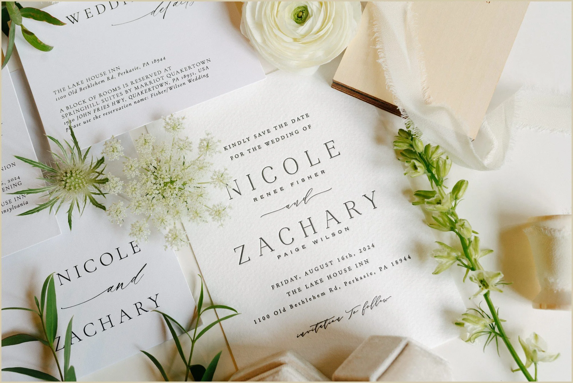 close up of a simple elegant white wedding invitation 