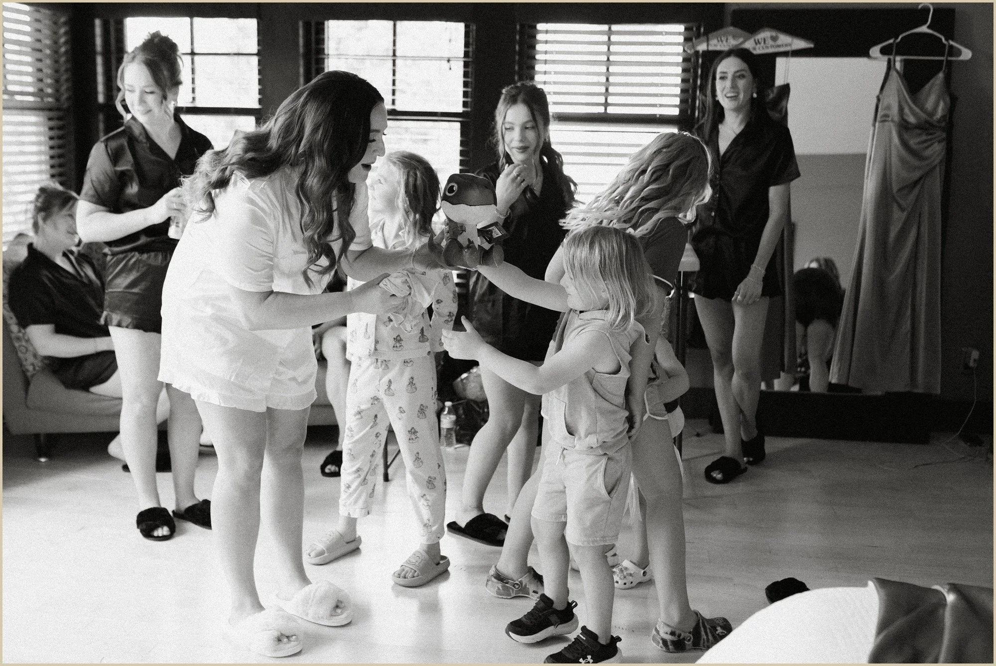 documentary candid of bride gifting flower girls presents