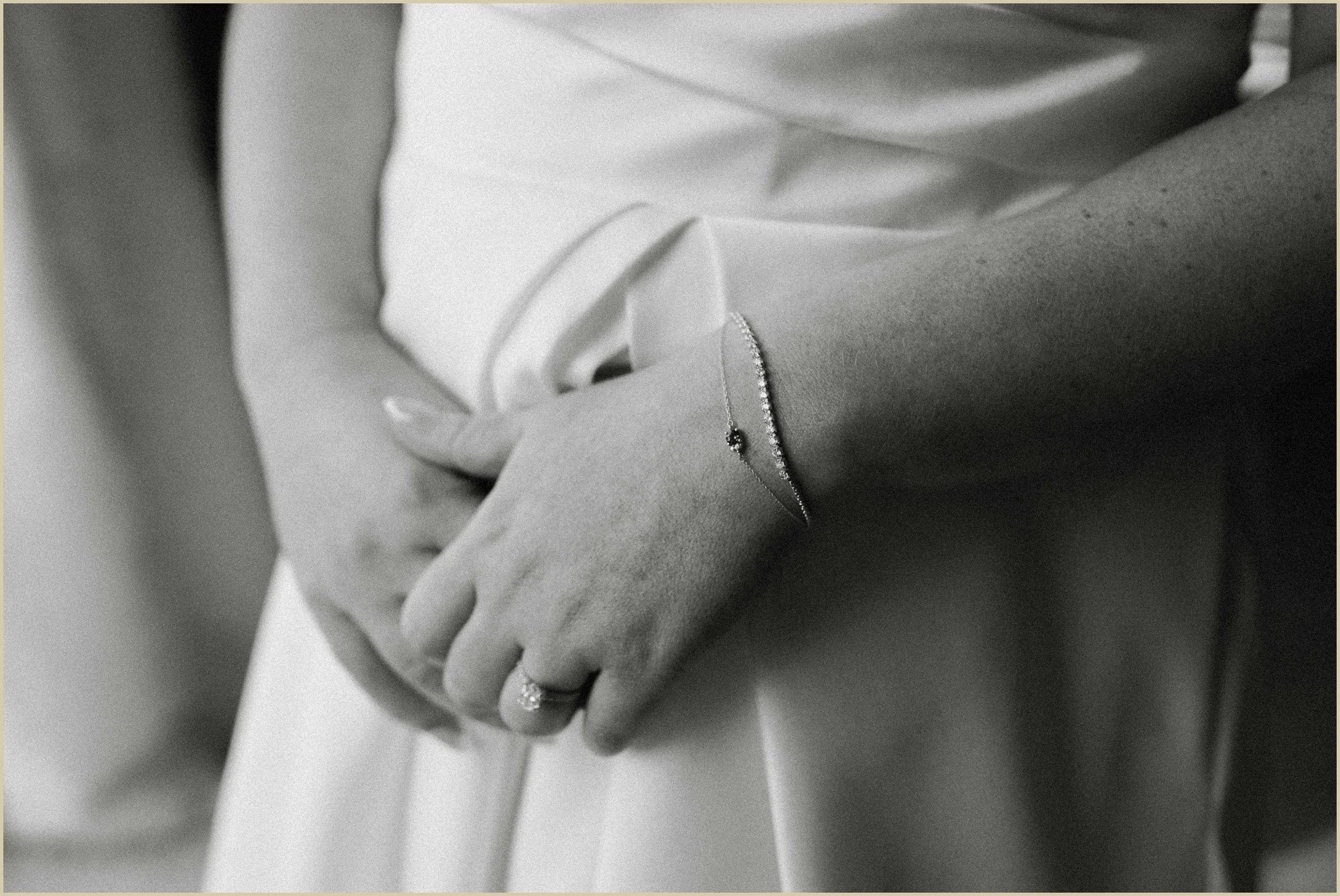 black and white detail photo of brides bracelets