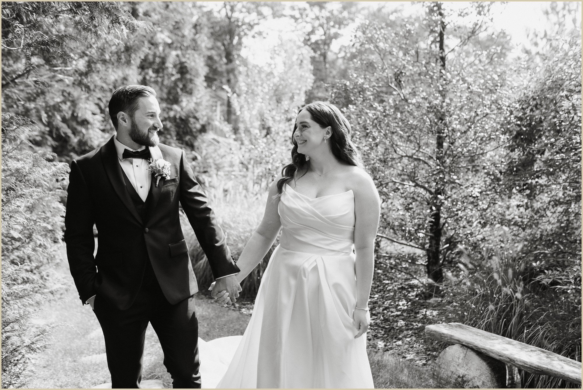 black and white photo of bride and groom looking at each other