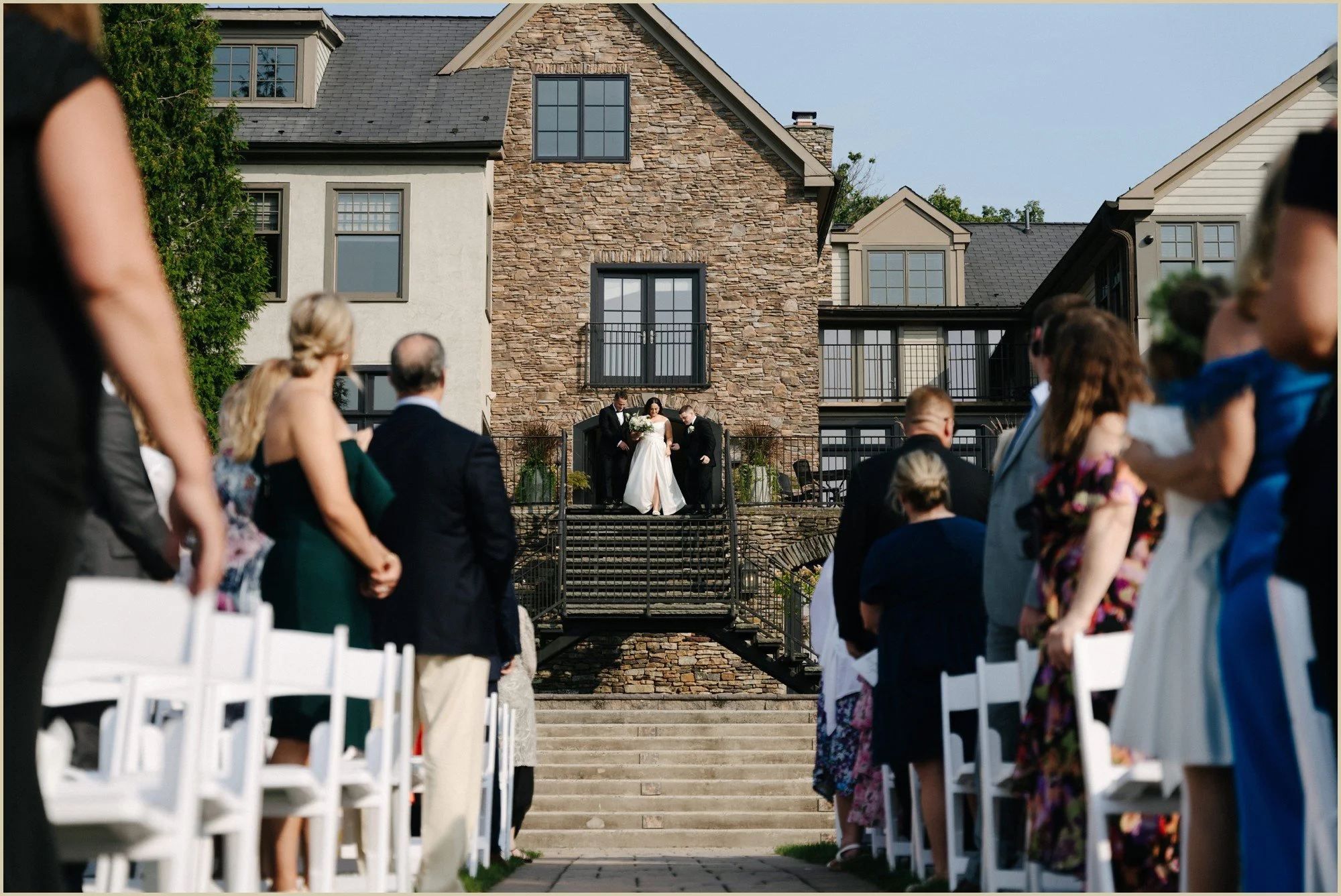bride walking down the aisle with her brothers