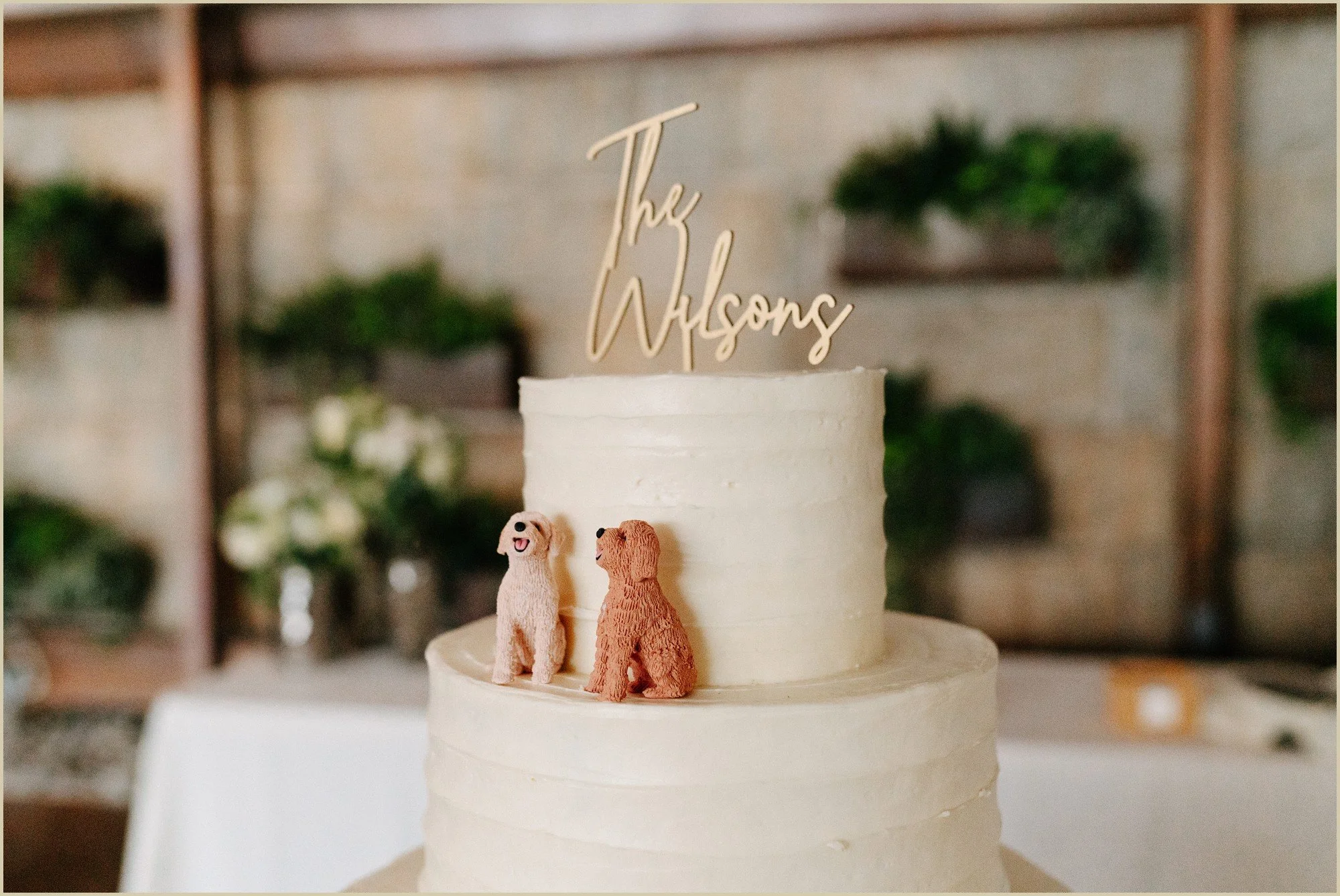 wedding cake with two dog figurines 
