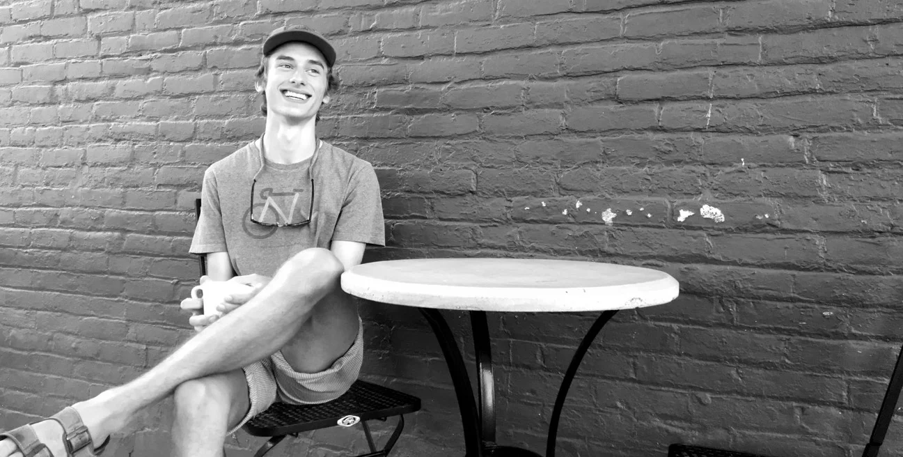 Ross Hooley , Studying in NZ but never forgotten! Ross moonlights full time here in the summer with us and we are honored to have him manage us as he is the ONLY employee with any type of business degree. Ross may be the best milk steamer we've ever seen, but we feel most lucky when he schleps in his record player to fill the shop with Simon and Garfunkel tunes. He might like fishing or getting lost in the woods or something but we aren't sure (read: we ARE sure and he LOVES those things). Ross is passionate about Patagonia.com, banging on steel drums, and working with Becca & Brittany. Favorite drink: the North Perk