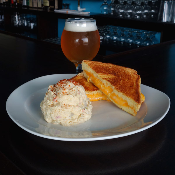 Grilled Cheese: Provolone cheese, cheddar cheese, Monterey jack cheese. Served on thick garlic buttered toast. $7