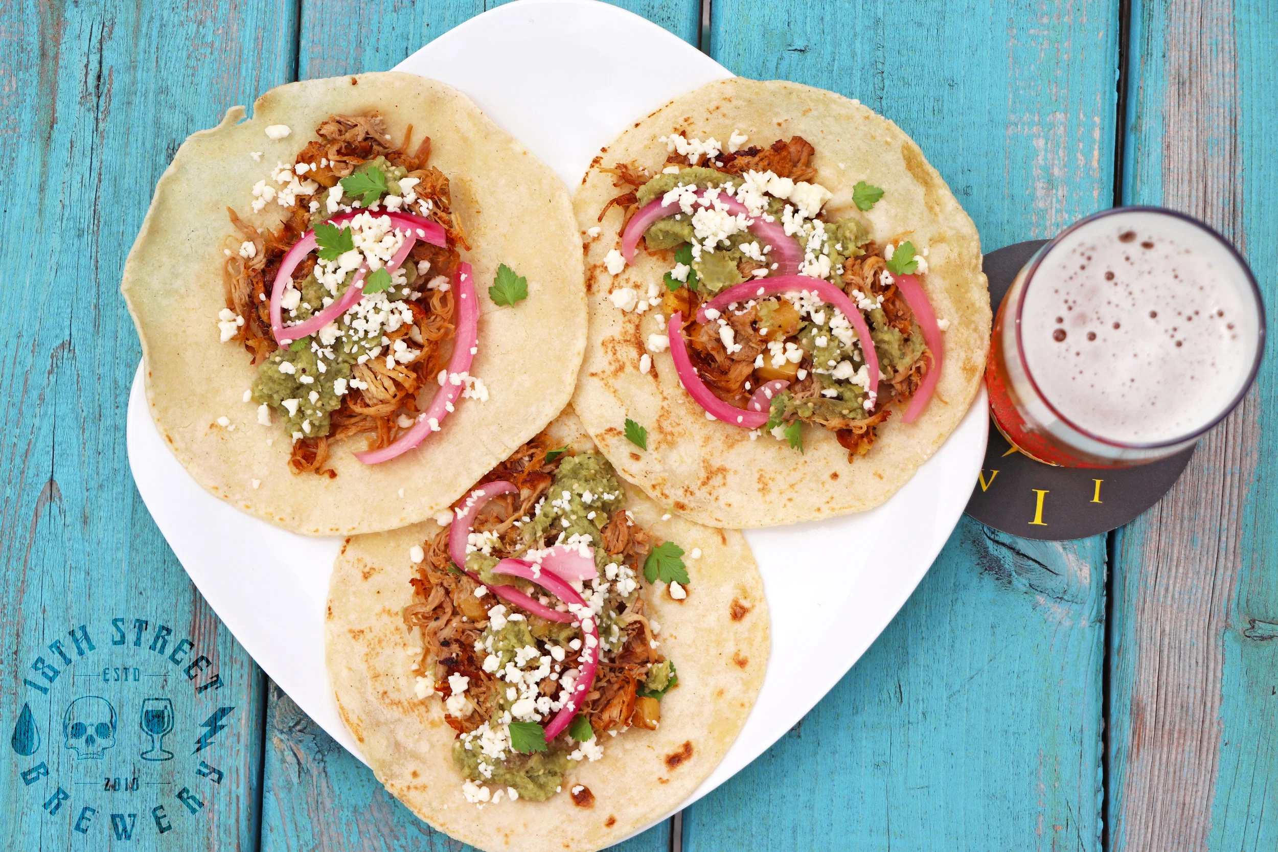 Stop in today and get your hands on our Taco Tuesday Feature! We've loaded these housemade cilantro, corn and lime tortillas with our delicious handpulled pork and then topped them with smoked pineapple, cilantro and salsa verde. End your Tuesday on a delicious note with a glass of 'The Fox & The Goat'. 'Taco Tuesday' is available for $8 all day, every Tuesday at our Hammond Brewpub. #eatindiana #eatlocal #eathereindy #eatIN #tacotuesday #alpastor #porktacos #drinklocal #drinkindiana #drinkIN #craftbeer #brewpub #18thstreetbrewery