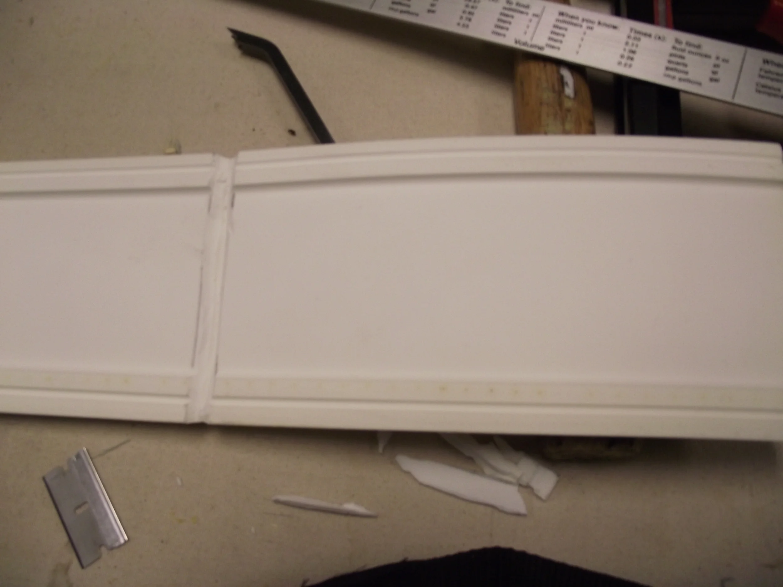 Material is cut from the corners of the bendable molding to allow close to a 45 degree angle on corners. Care is taken not to cut all the way through the molding.