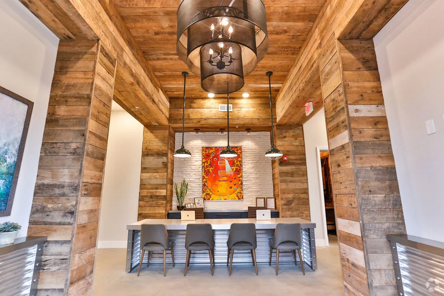 The multi-family clubhouse is edgy, modern luxury with a hint of warm woods, rustic metals and soothing furnishings.