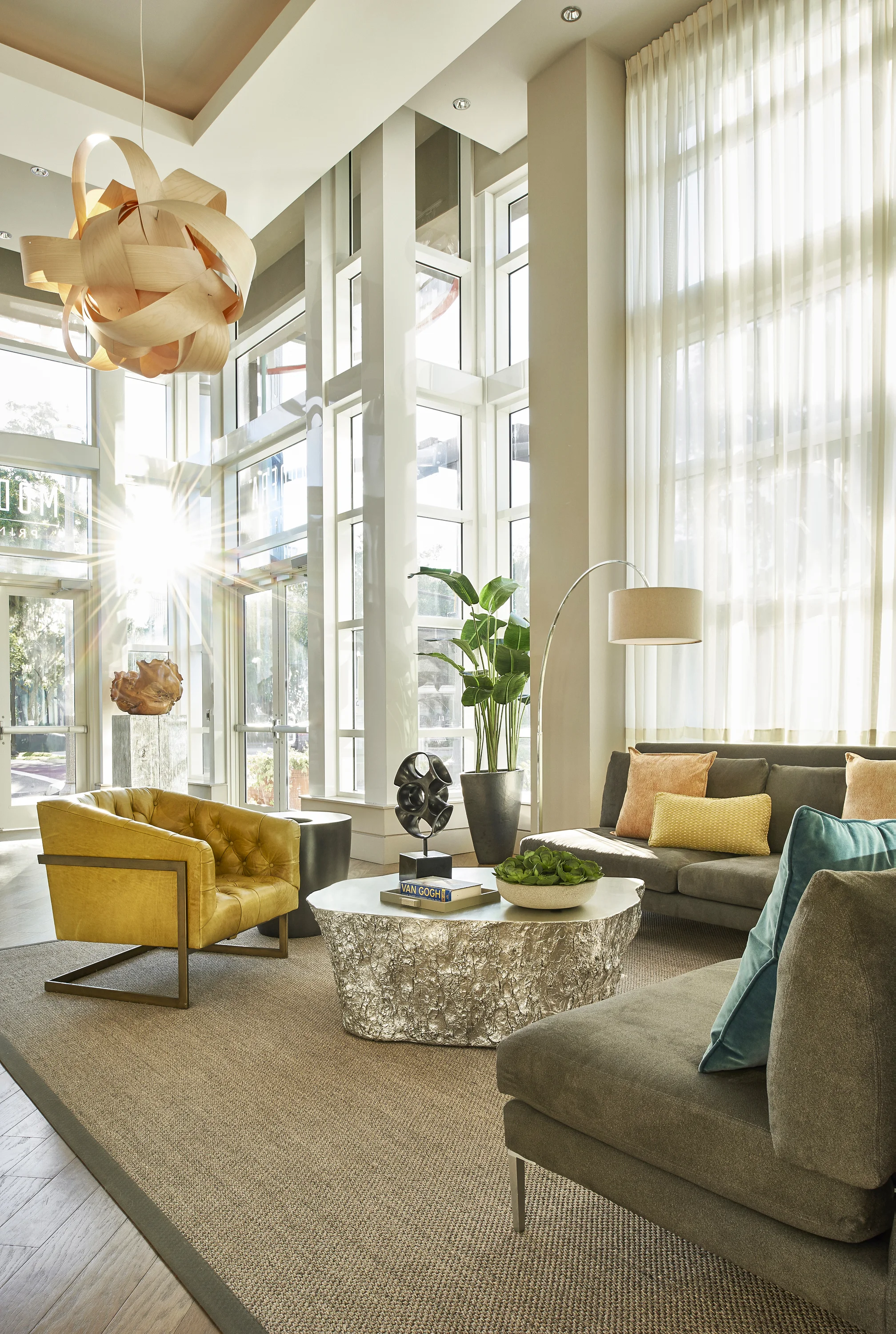A dramatic lobby with a slightly edgy aesthetic that will naturally invite residences to sit down and relax.