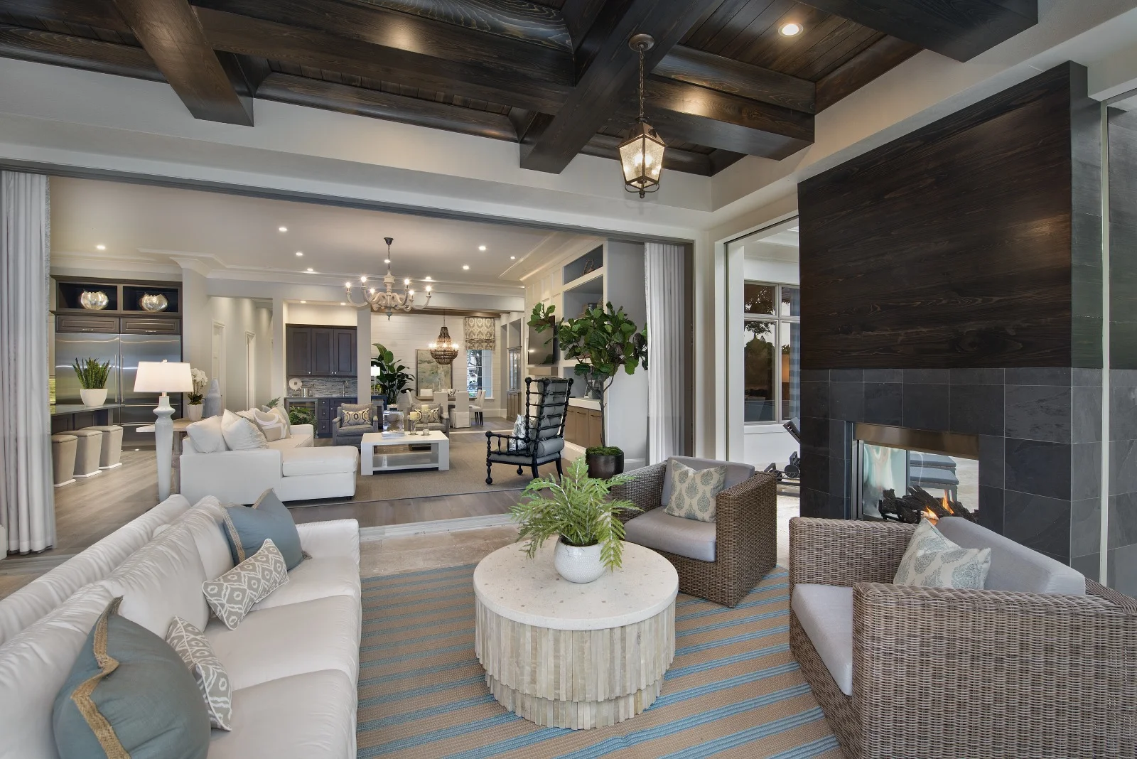 We are favoring the idea of cultivating an outdoor space with comfy designs you would normally place inside, such as decorative coffee tables, plush seating and decorative pillows.