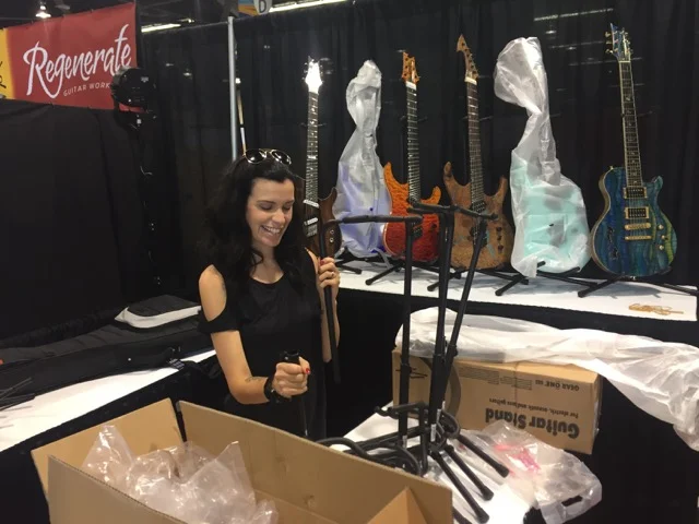 Mrs. Ormsby put the guitar stands together