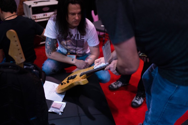  Getting a demo of a fretboard cleaner -&nbsp;Photo by Chris Lazzaro 