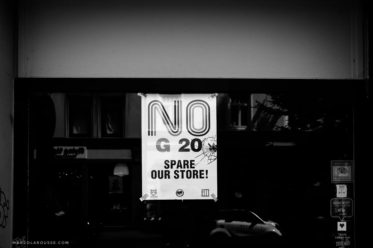 Others hang up signs and ask to spare their stores from damaging them as they are also against the G20 politics.